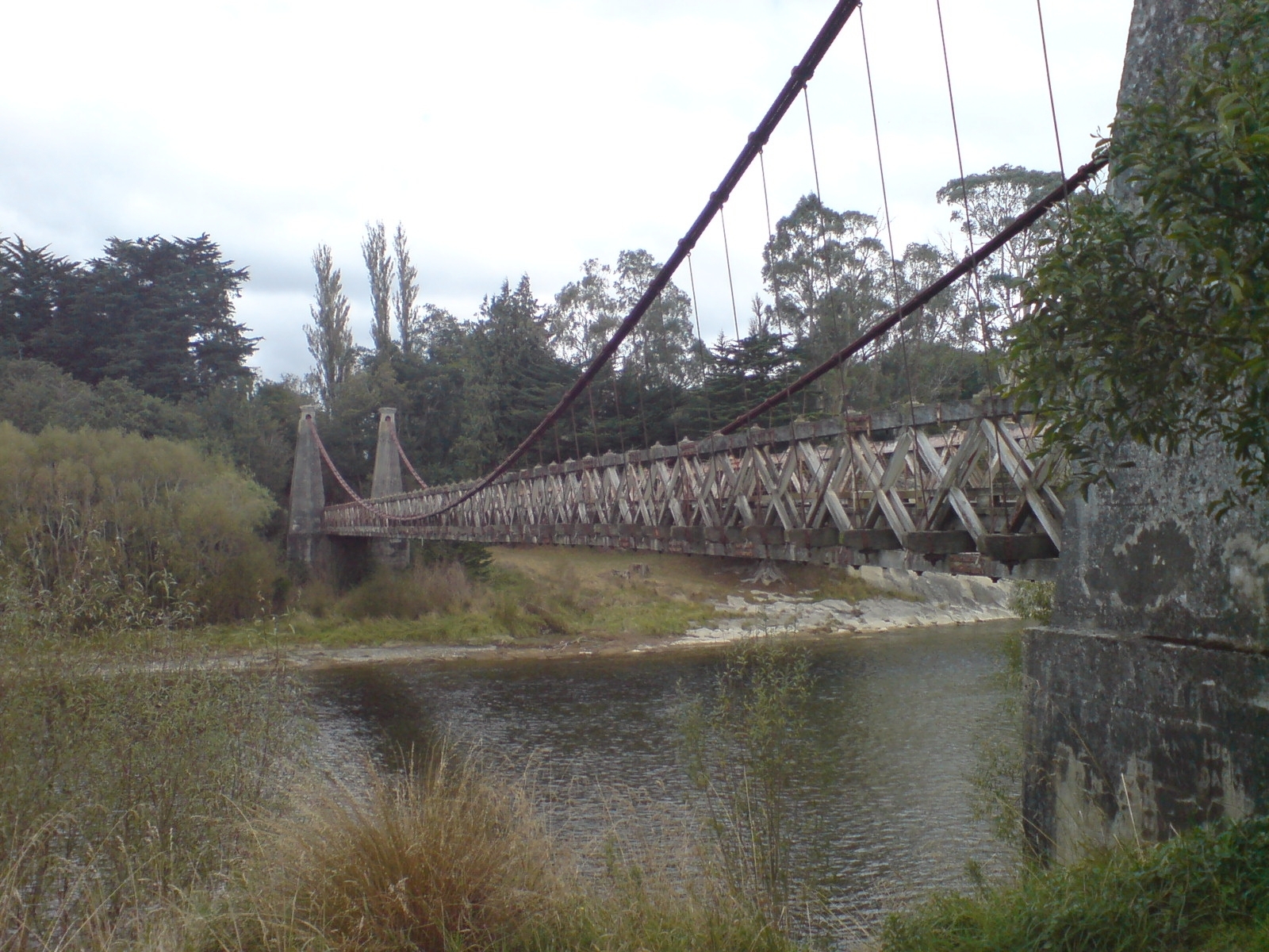The Clifden Suspension Bridge in Southland, New Zealand. Looking roughly southwest. New Zealand Historic Places Trust Register number: 4921