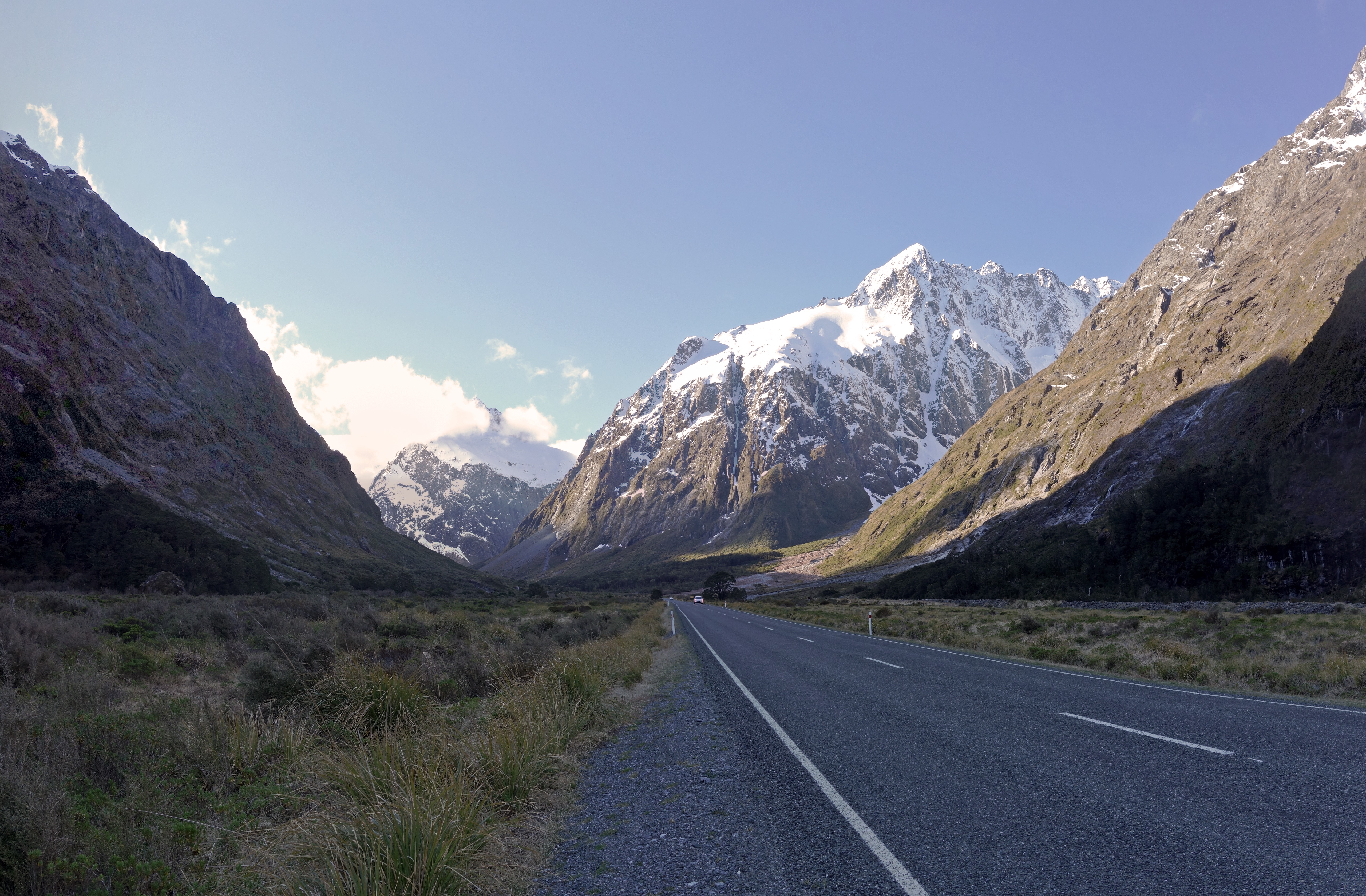 New Zealand's State Highway 94 as it travels through the Upper Hollyford Valley towards Milford Sound. Mount Crosscut rises right of center