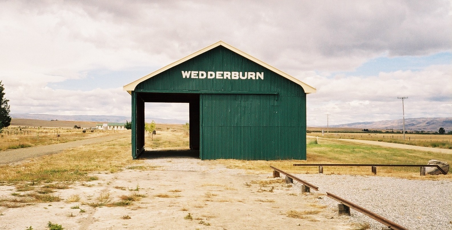 Wedderburn Shed, Otago
Author: User:Velela. 
Location: Wedderburn, Otago, New Zealand
Source: Personal photograph taken by Author December 2004
Description: The Wedderburn Goods Shed on the now abandoned stretch of  Otago rail line.

Technical data: Pentax  MZ-5 camera.