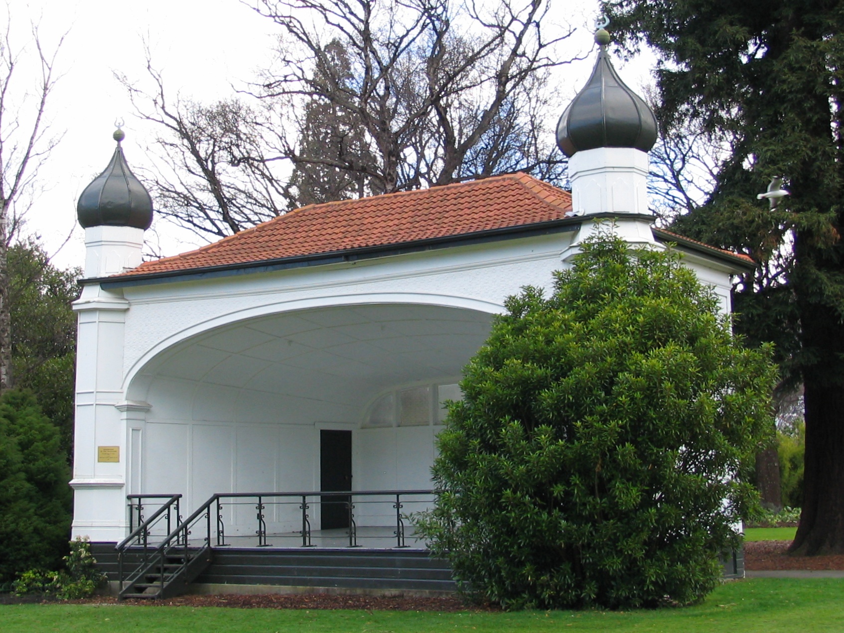 Bandstand in the Dunedin Botanic Garden, New Zealand.
The plaque reads "Restoration of this bandstand was made possible by a grant from AMP Perpetual Trustee Company N.Z. Ltd. 1989"