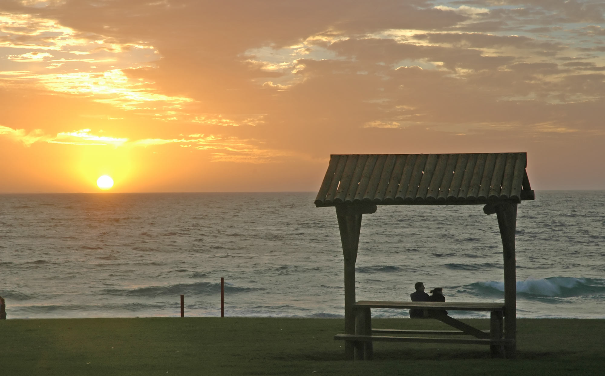 The sun setting on the Indian Ocean near Perth, Western Australia, Australia.City Beach Sunset