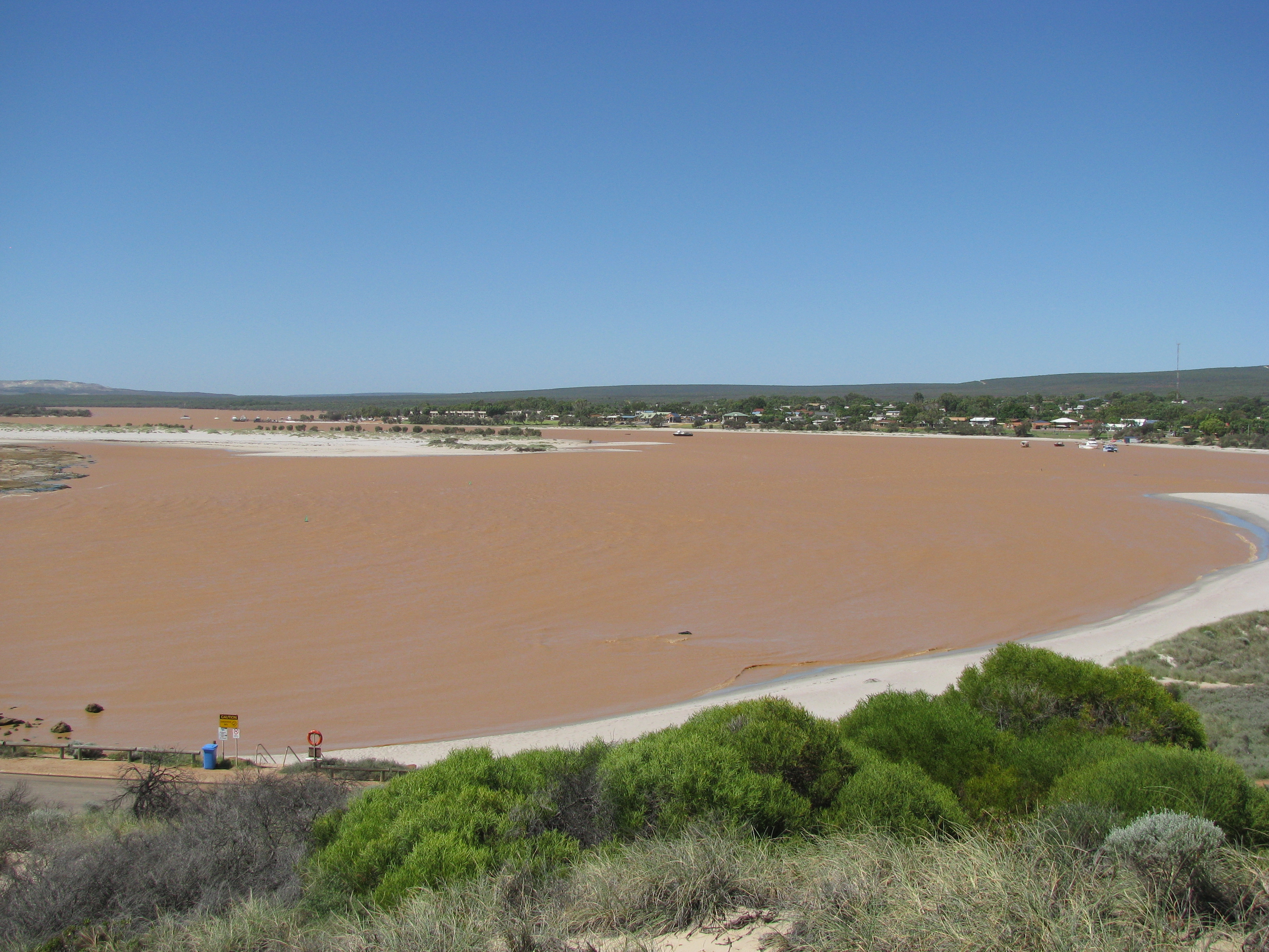 After heavy rains the Murchison river turns a vibrant brown color, laden with chemicals, dead animals, fecal matter and dangerous bacteria. This is dangerous to swim in and fish from. It is also a breeding ground for mosquitoes which carry harmful diseases.