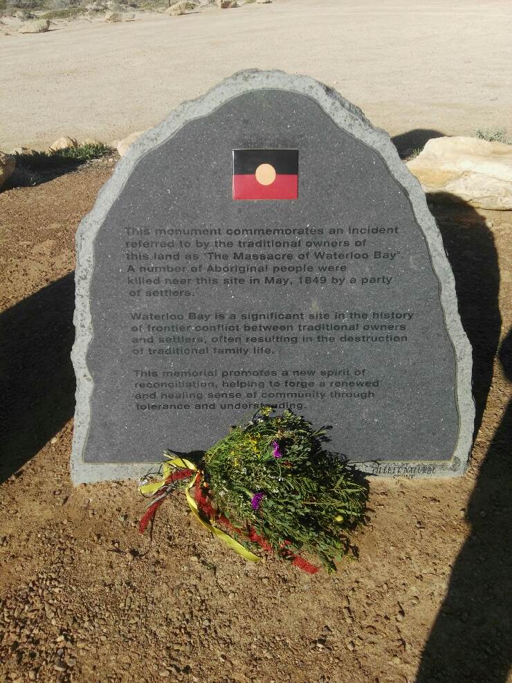 A memorial plaque commemorating the Waterloo Bay massacre