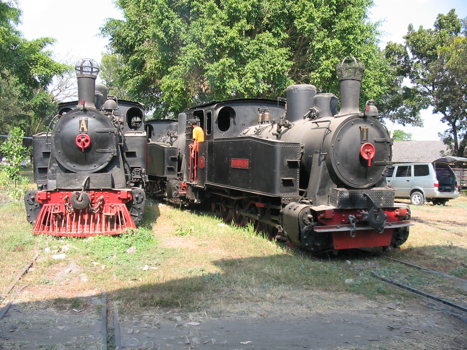 Three Berliner Maschinenbau steam locomotives on the Cepu Forest Railway in Central Java, Indonesia. These locomotives: B "Bahagia", T "Tudjubelas" and A: Agustus" were built in 1928 and are currently(2003) still active.
