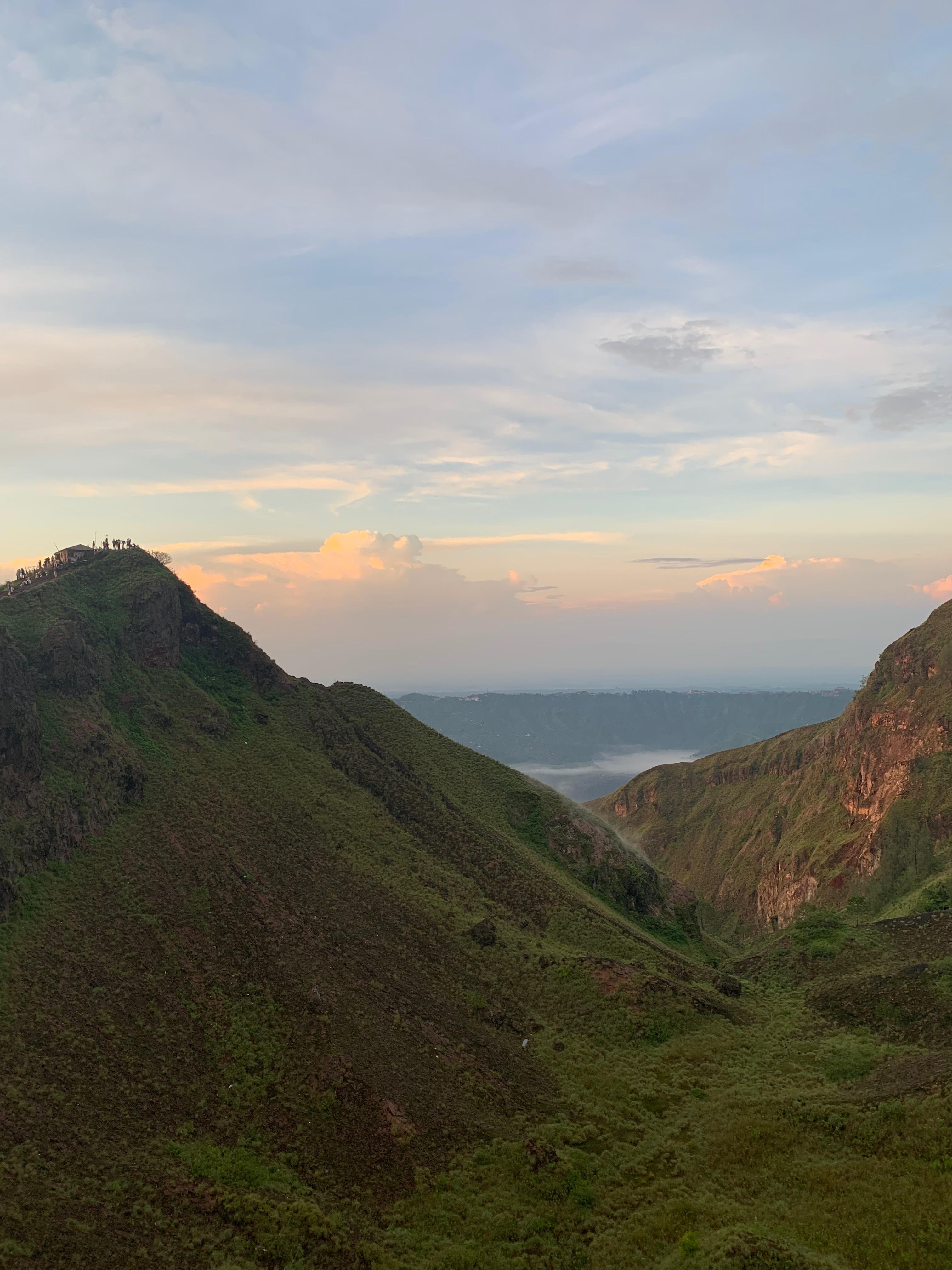 Photo captured at the top of a hike up Mount Batur in Bali, Indonesia during sunrise.