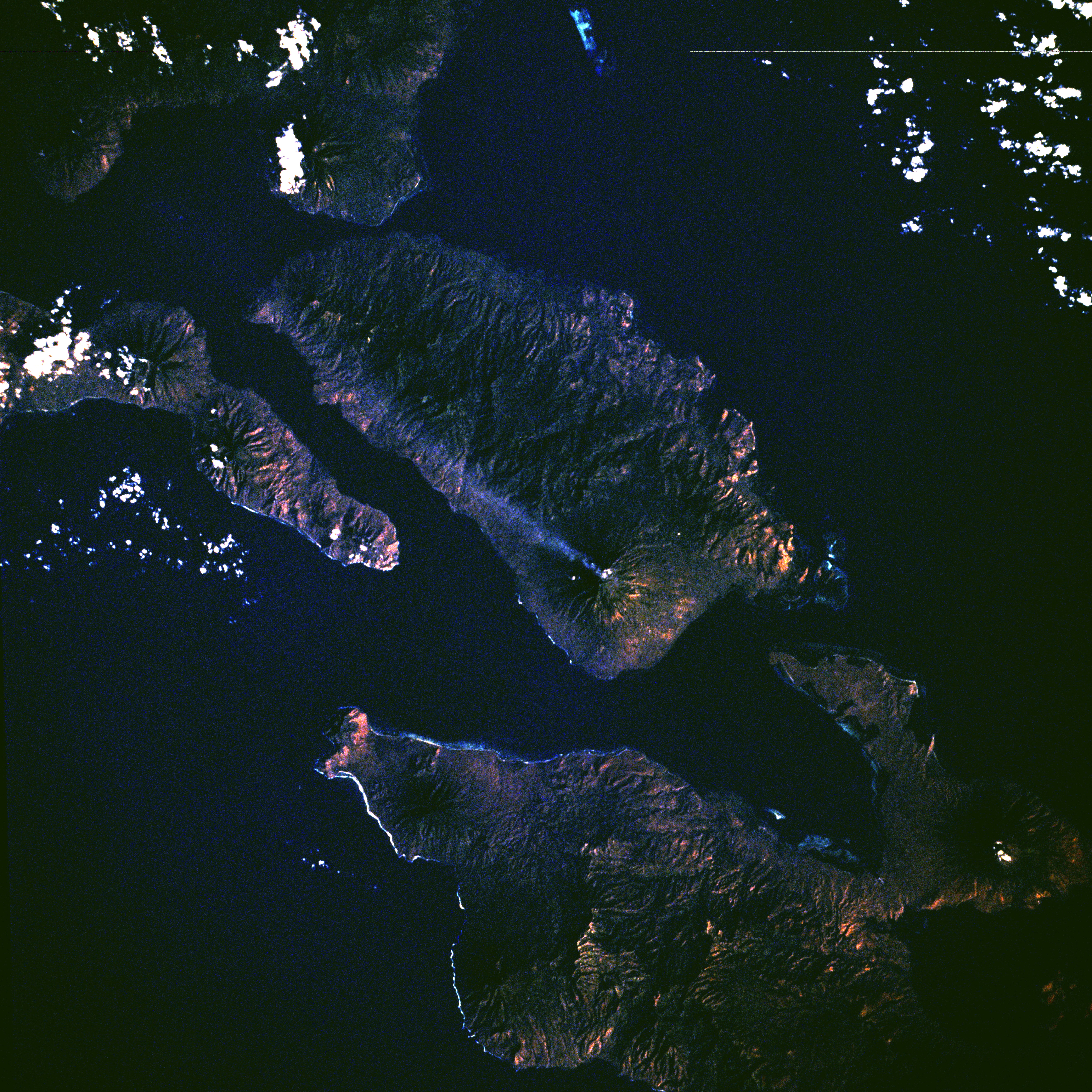 w:Adonara Island, Indonesia, with eruption plume from Ili Boleng volcano visible.  Photographed from Space Shuttle, mission STS008.
