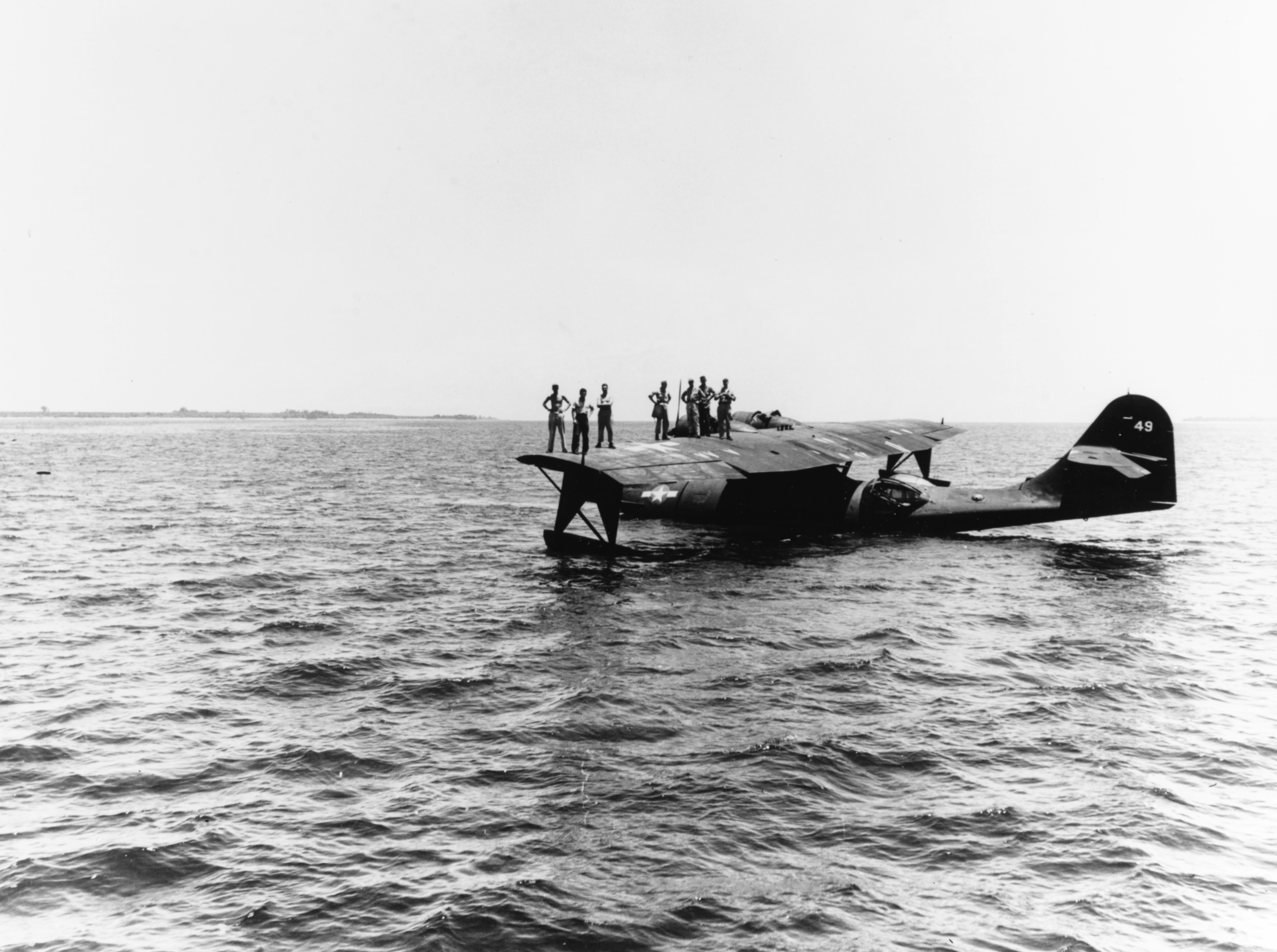 U.S. Navy Consolidated PBY-5 or PBY-5A Catalina waits off the Morotai shore to pick up press copy giving accounts of the landings there, 15 September 1944.