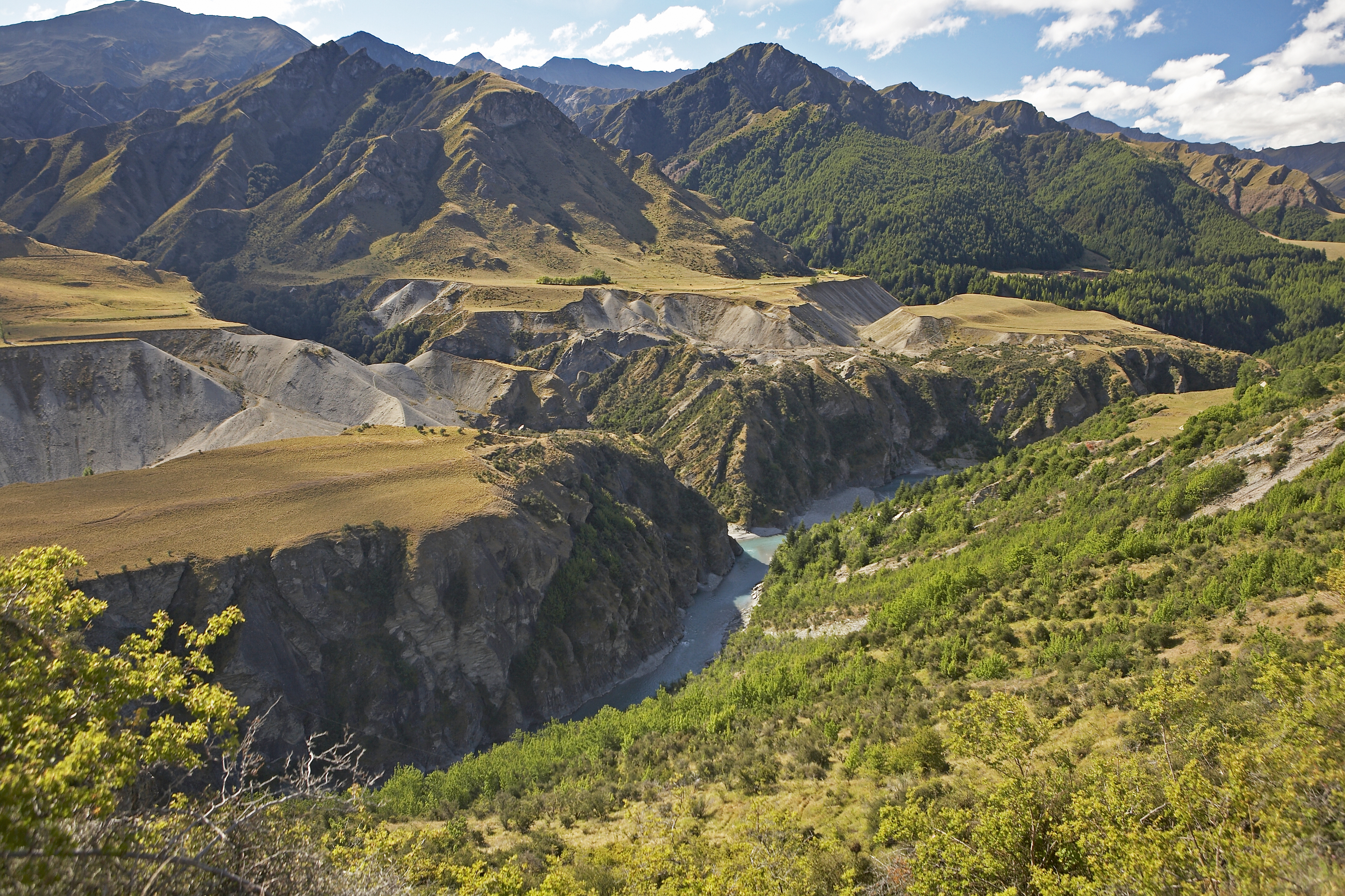 An overview of Skippers Canyon, seen from Maori Point Saddle. The Shotover River is icy blue.