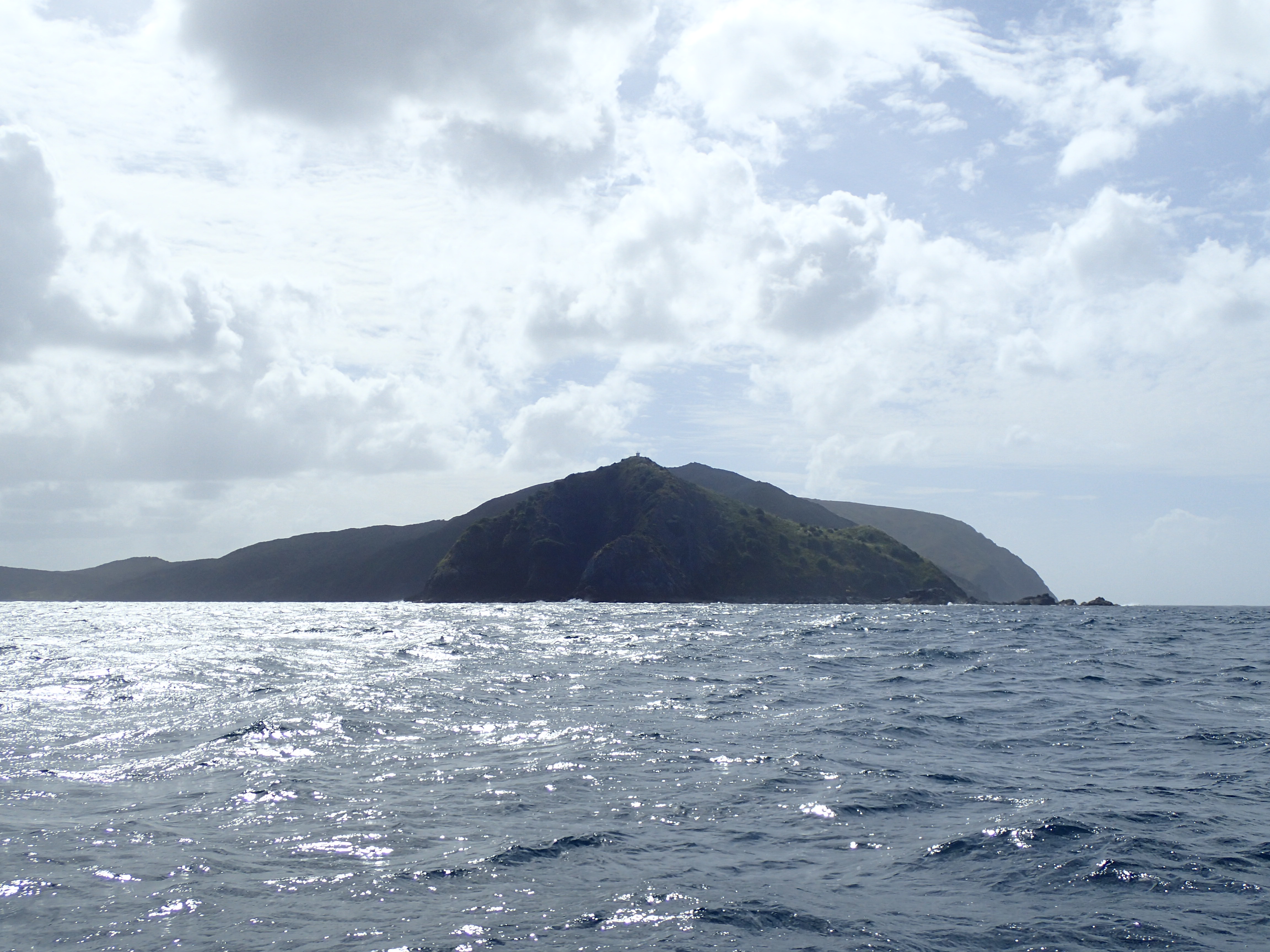 Murimotu Island (foreground) with the Lighthouse just visible on top, Otou just behind the light to the right and Surville Cliffs extending out to the right in the background