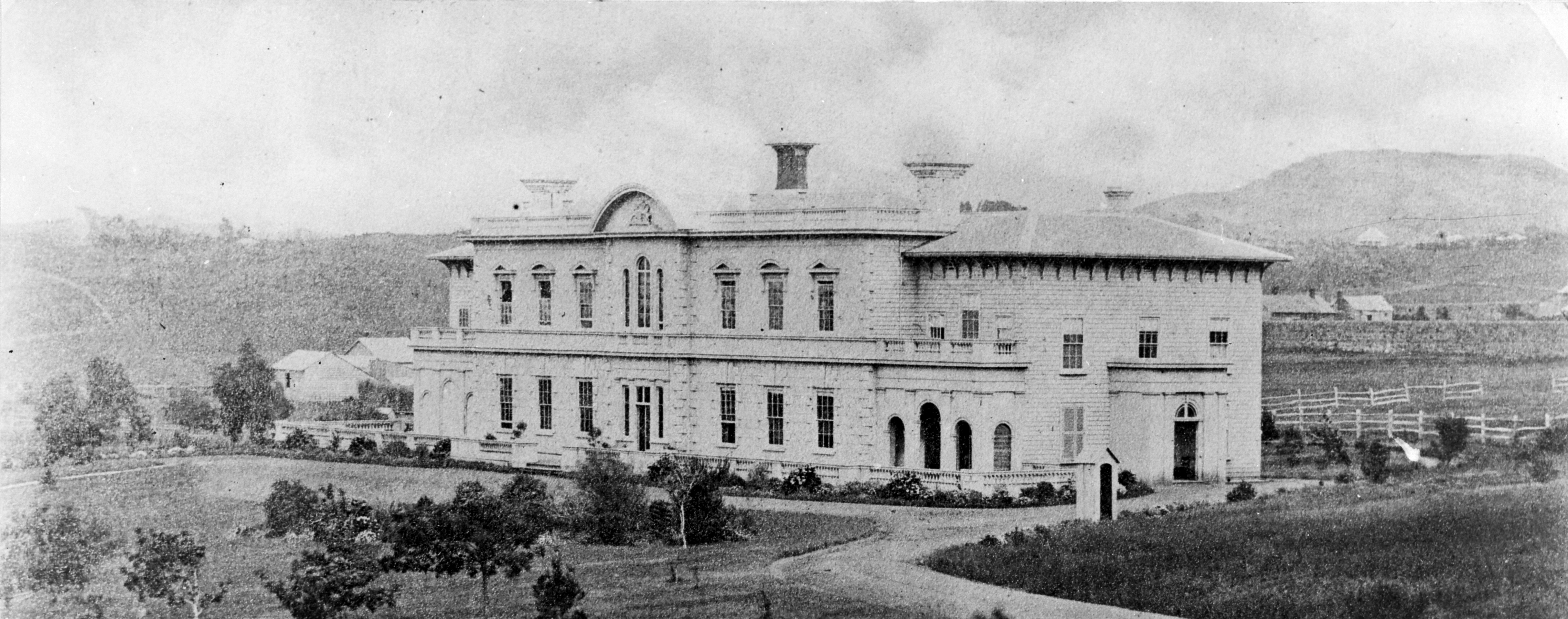Auckland Government House in Auckland City, New Zealand. Auckland was the seat of New Zealand's national government from 1841 to 1865. This is the third Government House to exist in Auckland alone, later to become part of the University of Auckland campus.
Extended information on origin webpage reads: Government House, Auckland [ca 1860s-1870s] / Reference number: 1/2-105456-F 1 b&amp;w copy negative(s). Film negative. Horizontal image. / Part of  Gilberd, Edward Browse, 1904-1991 :Photographs of Auckland  PAColl-8549) Photographic Archive / Scope and contents: Government House, Auckland, taken ca 1860-1870s by an unidentified photographer.