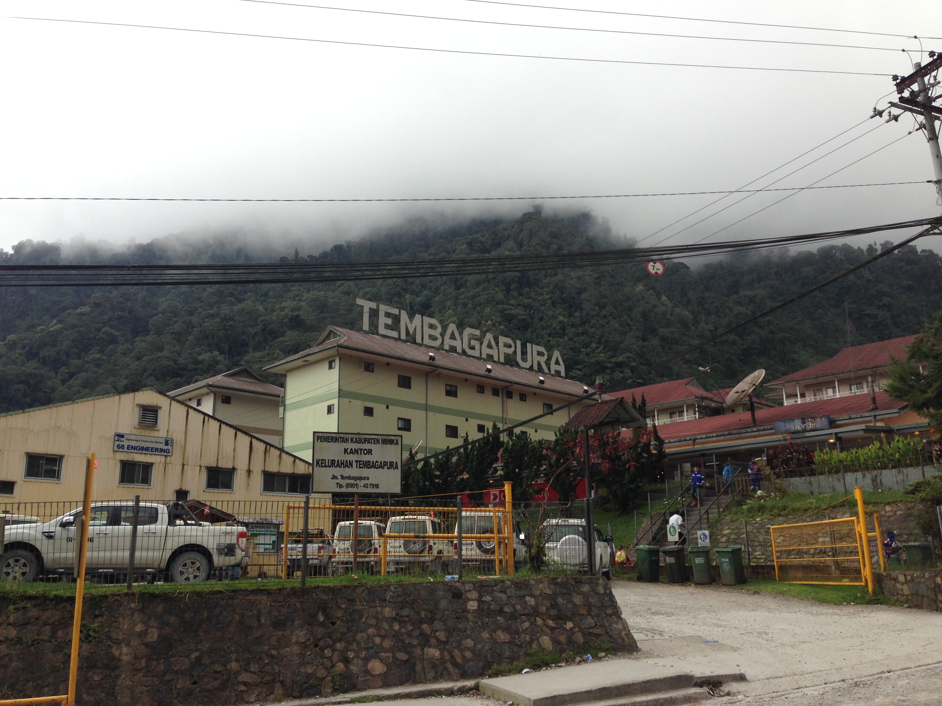 Tembagapura, Papua, Indonesia.  The company town for PT Freeport's copper/gold mine. Pictured, the building on the extreme left is a Freeport engineering office, the buildings in the middle and on the right are accommodations blocks. Taken around 1:30 pm, thick clouds are visible at the tops of the mountains, this is typical for this time of day.