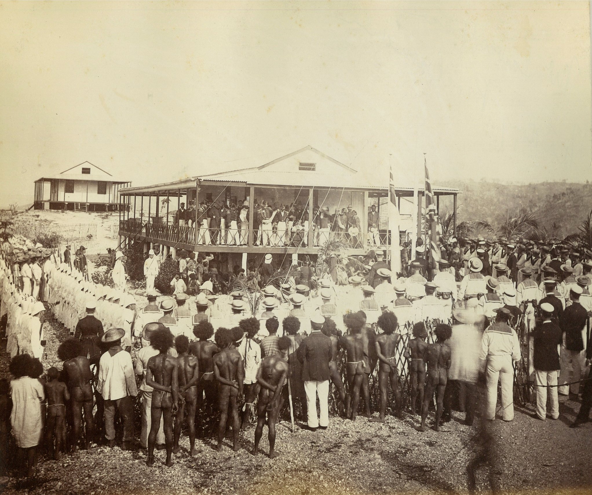Reading proclamation of annexation, Mr Lawe's house, New Guinea, November 1884, [attrib.] John Paine or Augustine E. Dyer, albumen print, State Library of New South Wales, SPF/2752