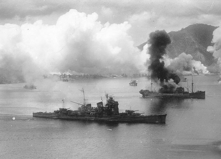 Aircraft of the USAAF 3rd Bomb Group attack Japanese ships in Simpson Harbor, 2 November 1943.

The heavy cruiser Haguro is in the foreground. She had been somewhat damaged during the battle of Empress Augusta Bay the previous night. The burning transport at right appears to be one of the Hakone Maru class, of which Hakone Maru, Hakozaki Maru and Hakusan Maru were still afloat at the time. The ship in the left distance, partially hidden by smoke, appears to be the submarine tender Chogei or Jingei.
