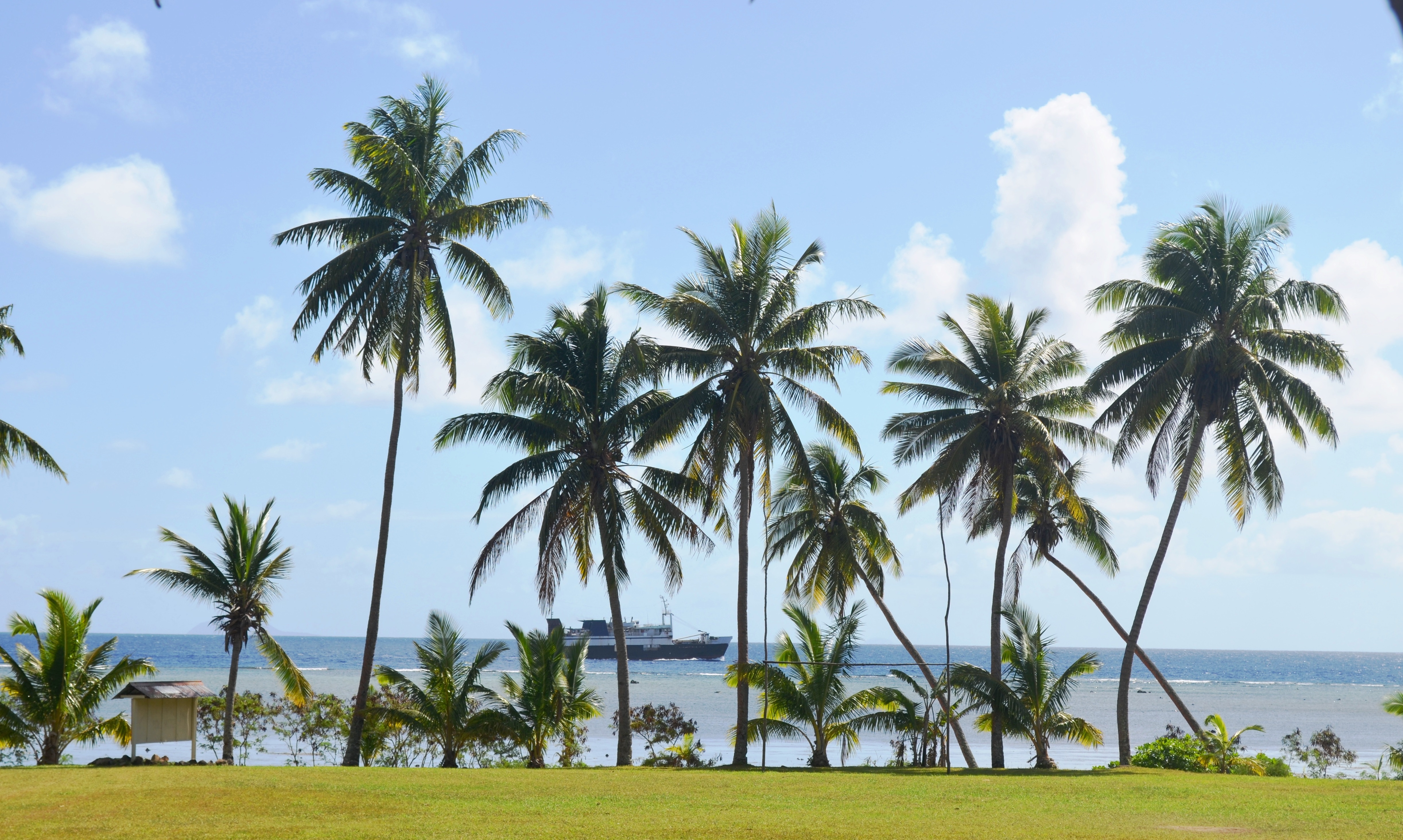 An inter-island vessel sails past one of the islands in the east of Fiji