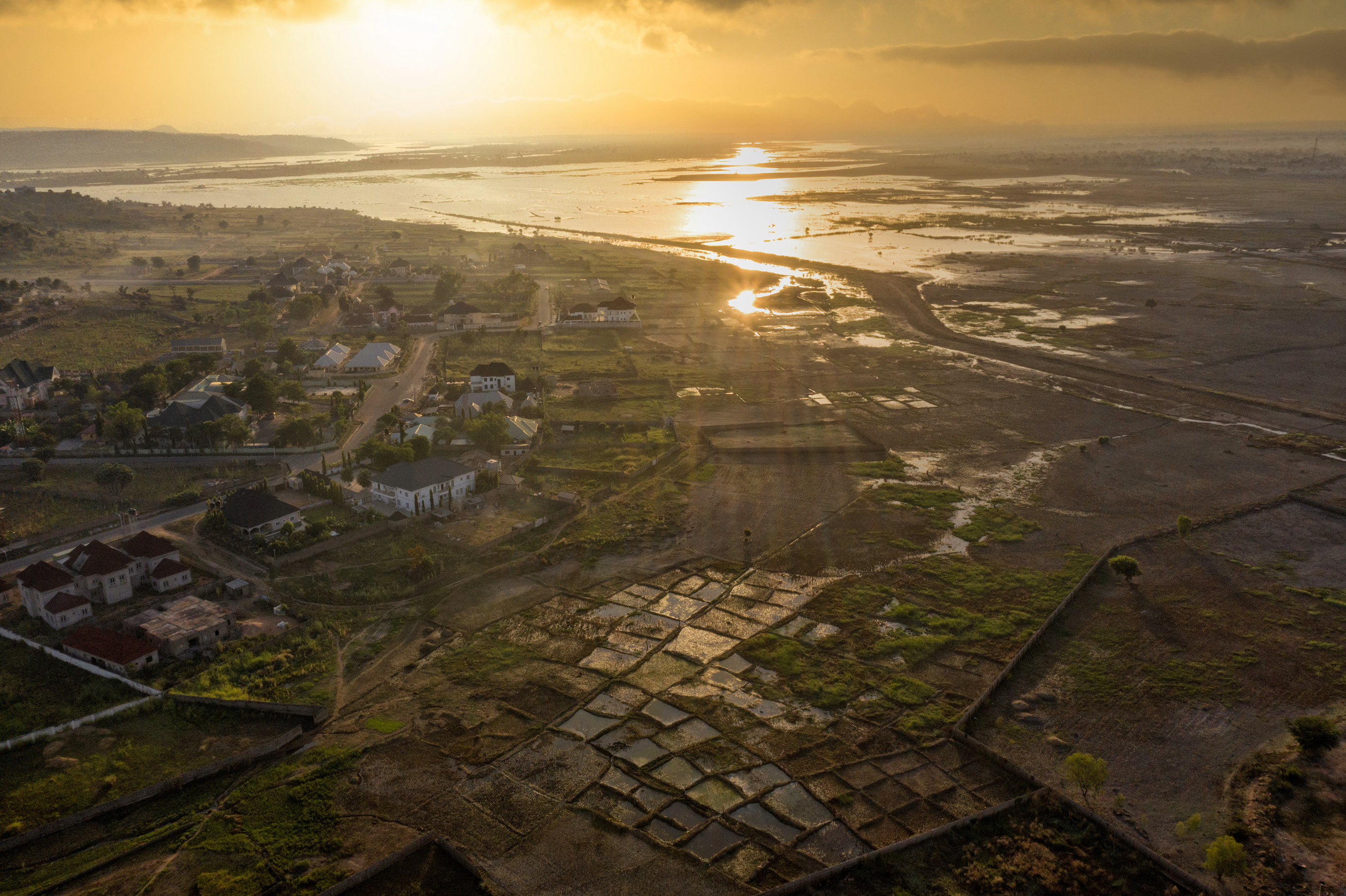 Global warming has had a negative impact on climate and weather patterns as is visible here with the River Gongola flooding some households and farmlands in Yola.