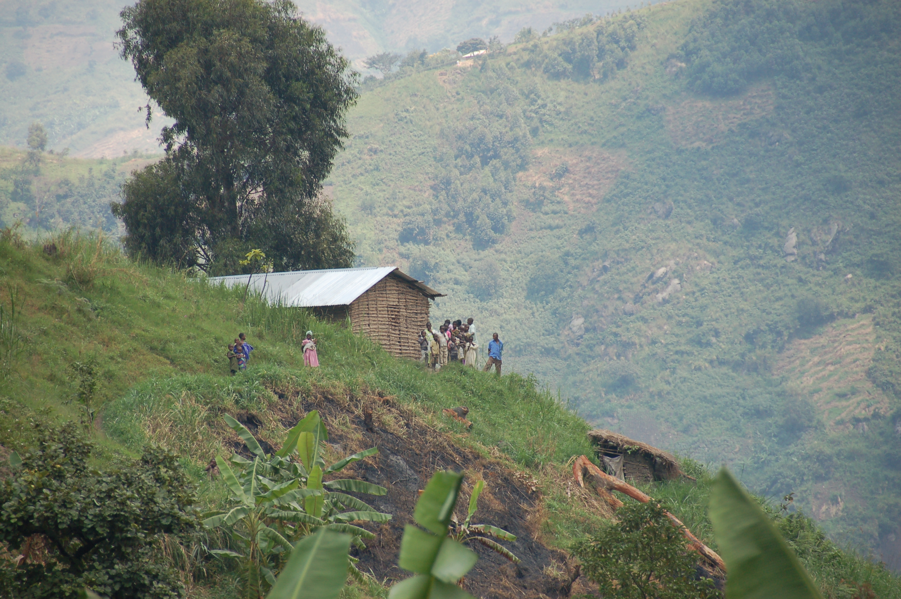 House and people in the Rwenzori Mountains, Kasese District, Uganda
