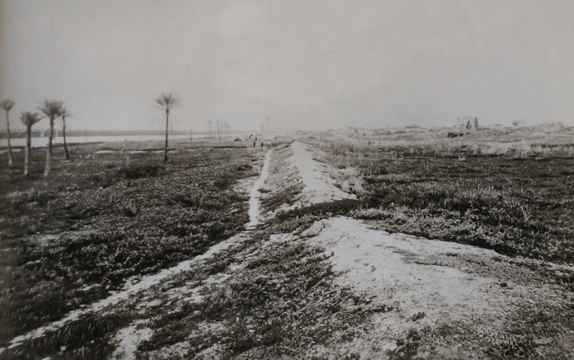 View of the ruins of the fort built on the Nile at Fashoda by the Egyptians in the mid-19th century. The entrance arch of what is left of the fort is visible in the background on the right. Photograph taken in July 1898.