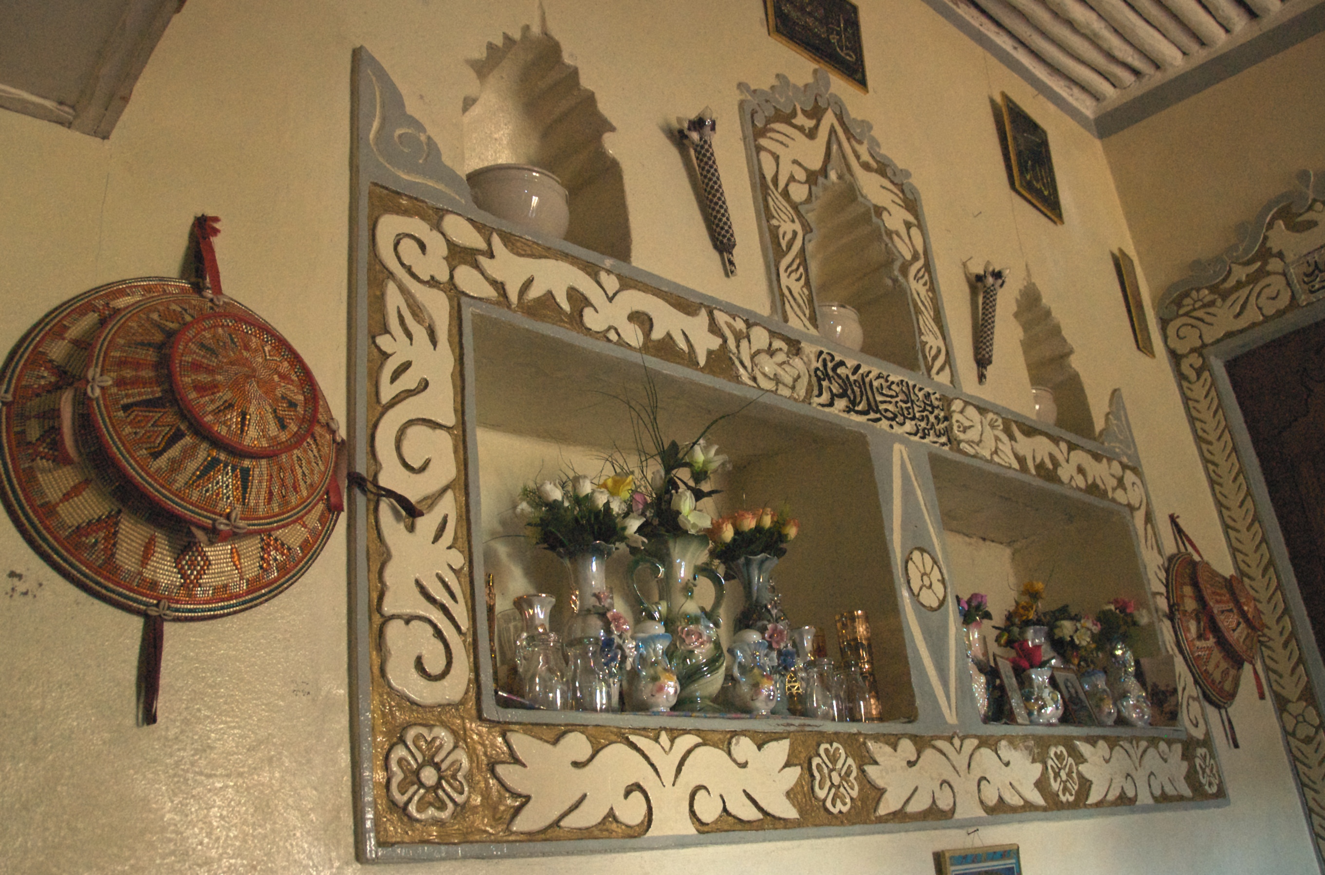 Traditional Harari homes have lots of niches, and they're full of interesting things.  I was fascinating by this collection.

Harar, Ethiopia.