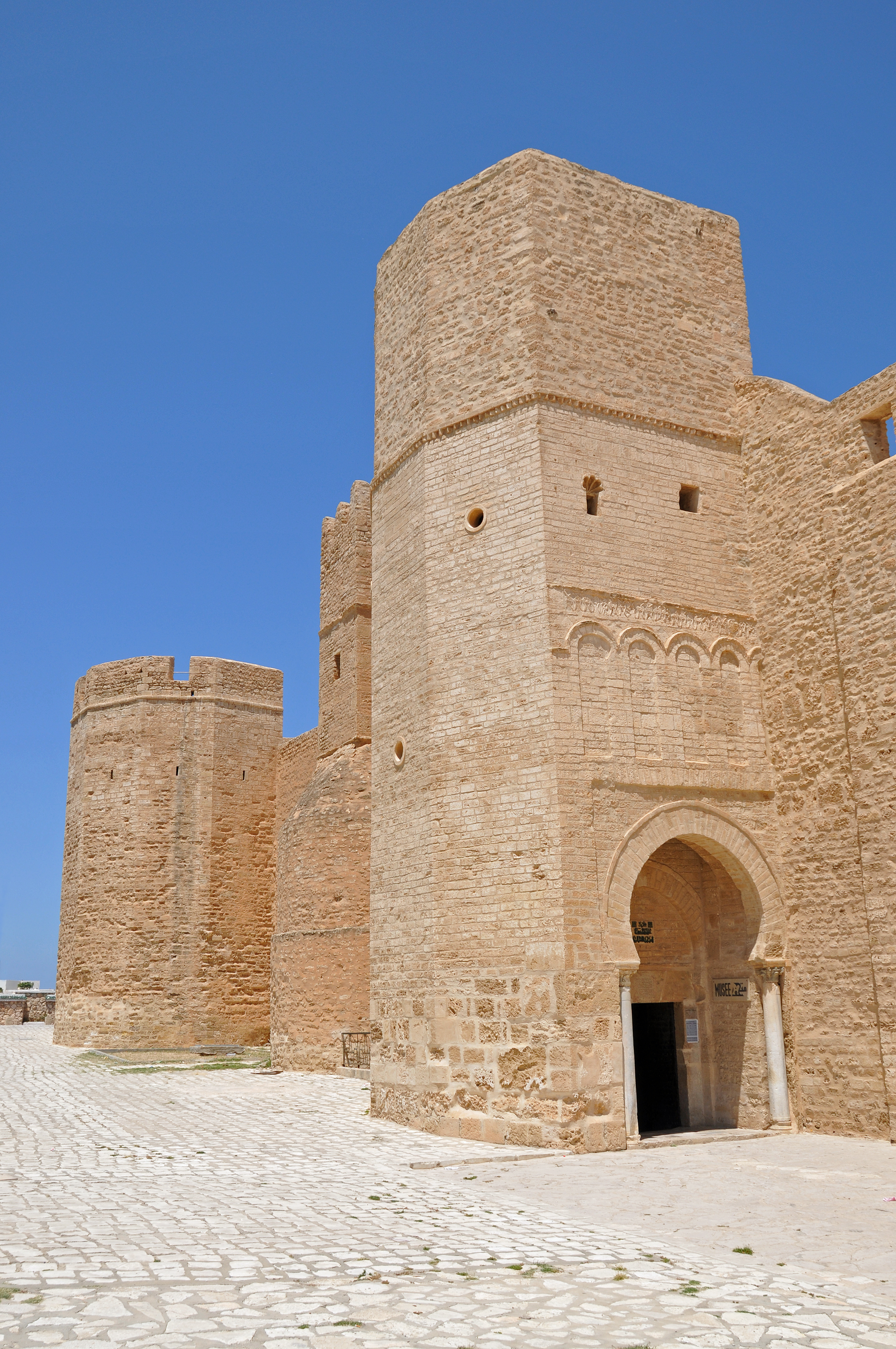 The ribat of Monastir is the oldest and most important defensive work to have been built along the North African coastline by the Arab conquerors in the early days of Islam.
Founded in 796, this building underwent several modifications during the medieval period. Initially, it formed a quadrilateral and then was composed of four buildings giving onto two inner courtyards. 

A spiral stair of about a hundred steps leads to the watchtower form the top of which visual messages were exchanged at night with the towers of neighbouring Ribats