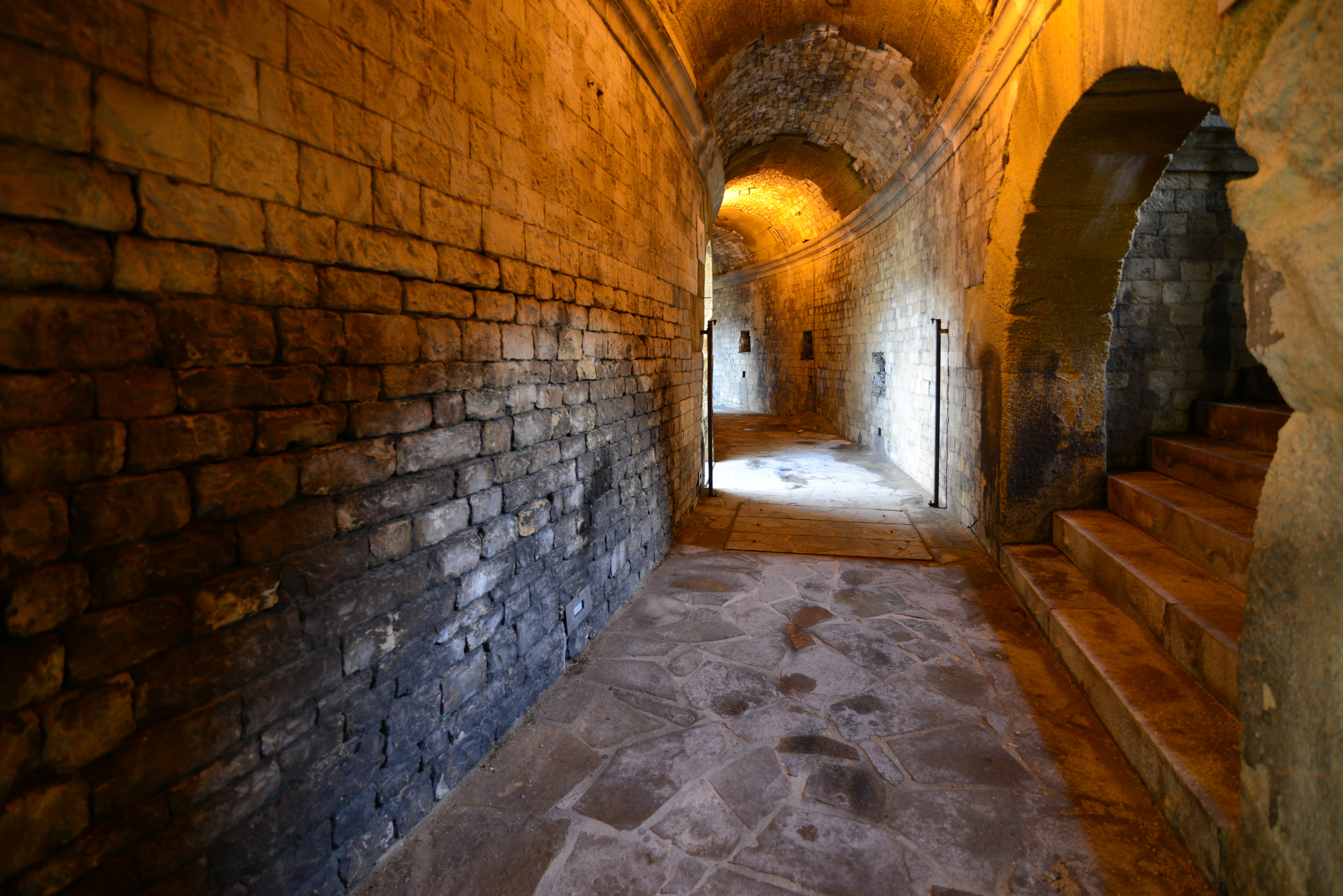 The Arena of Nîmes is a Roman amphitheatre, situated in the French city of Nîmes. Built around AD 70, it was remodelled in 1863 to serve as a bullring. 
The Arena of Nîmes is the site of two annual bullfights during the Feria de Nîmes, and it is also used for other public events. The arena served as a public event theatre built by the Romans as well as a gladiator fighting arena.

The building encloses an elliptical central space 133 m long by 101 m wide. It is ringed by 34 rows of seats supported by a vaulted construction. It has a capacity of 24,000 spectators and since 1989 has a movable cover and a heating system [Wikipedia.org]
