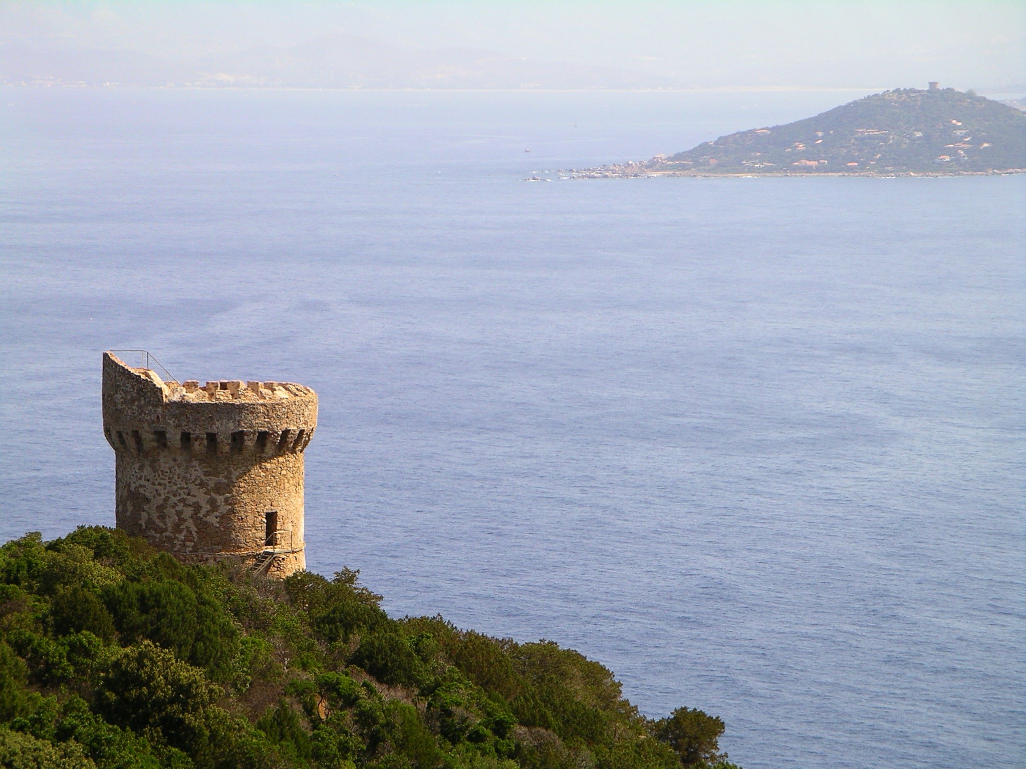 The Tour de Capu di Muru is a Genoese tower in the commune of Coti-Chiavari on the French island of Corsica. The Tour de la Castagna sits on the next headland and beyond that is the Golfe d'Ajaccio.
