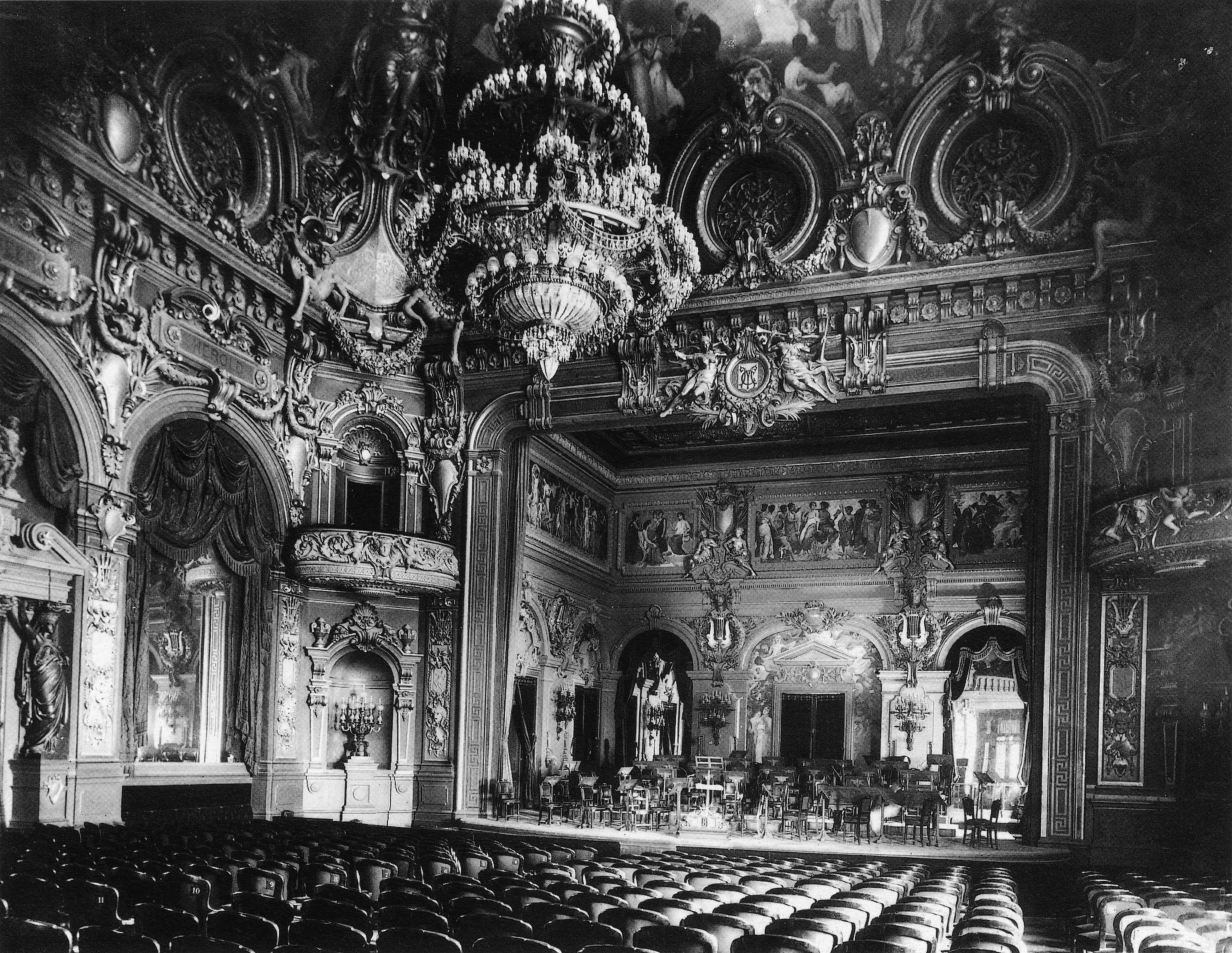 Photograph of the auditorium and stage of the Salle Garnier, concert hall of the Monte Carlo Casino as it appeared c. 1879, shortly after it opened. The theatre later became the home of the Opéra de Monte-Carlo.