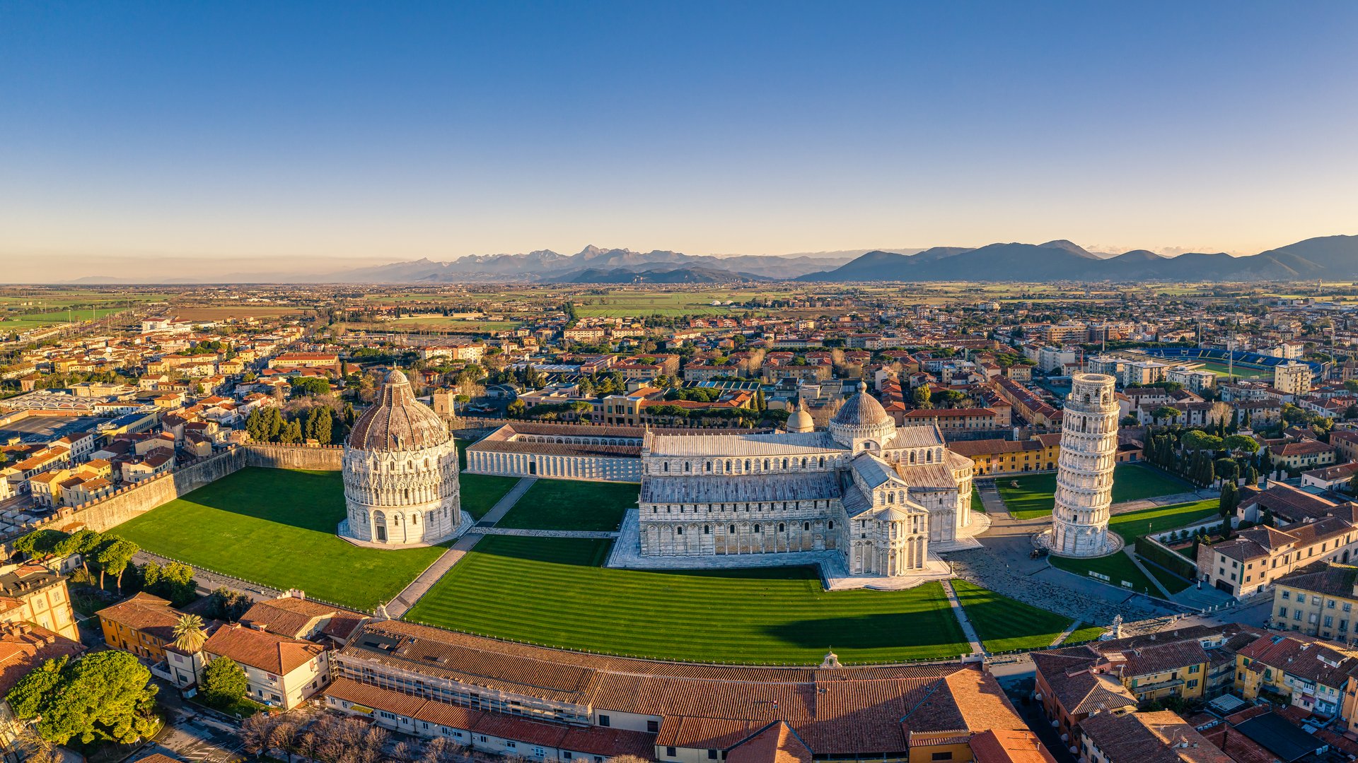 Aerial picture of piazza dei Miracoli, Pisa, Tuscany. A view to Alpi Apuane and Monti Pisani mountains.