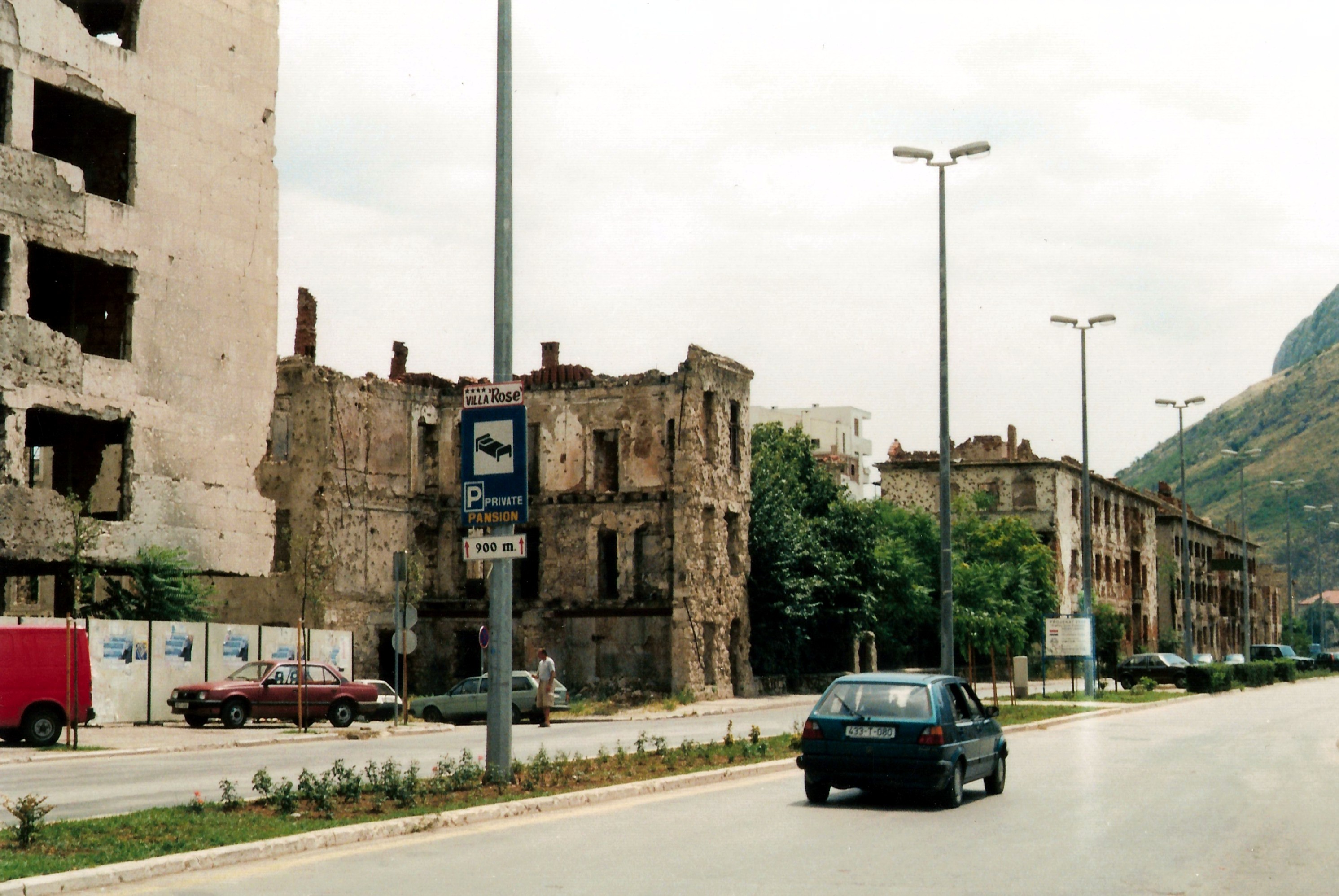 Damaged houses in Mostar (the west bank (Croat)) . Damage is from the Bosnian War. Geolocation is a guess.

Scan from a conventional photo. Enhanced with The Gimp.