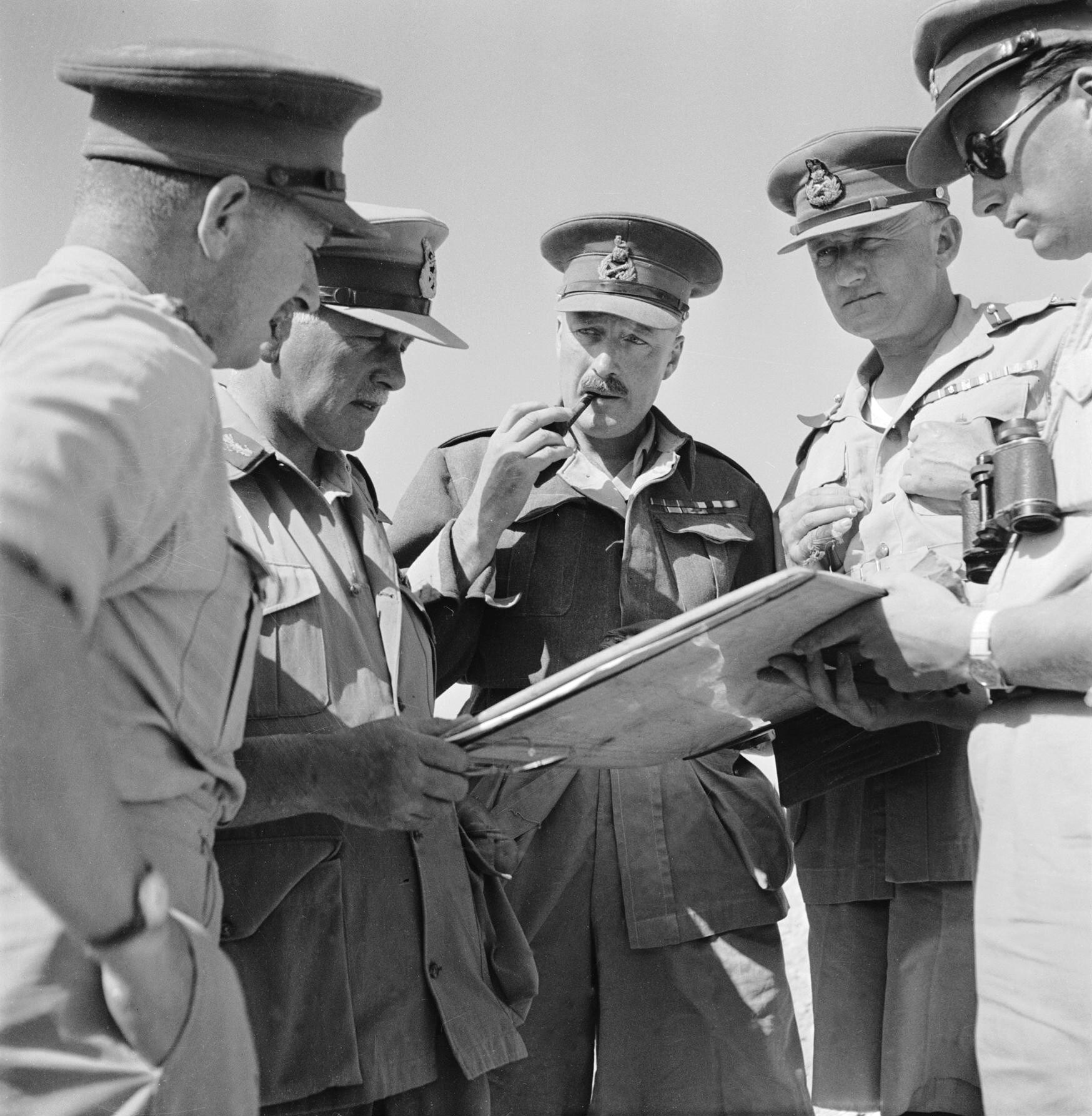 IWM caption : General Sir Neil Ritchie (1897 - 1983): Lieutenant General Ritchie, Commander in Chief 8th Army, with his Corps Commanders, Generals Norrie and Gott, during the Battle of Gazala.