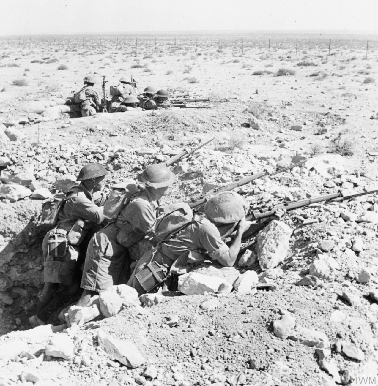 IWM caption : Australian troops occupy a front line position at Tobruk. Between April and December 1941 the Tobruk garrison, comprising British, Australian and Polish troops, was besieged by Rommel's forces. It fell to the Germans after the battle of Gazala on 21 June 1942 but was recaptured five months later.

Comment : see Siege of Tobruk.