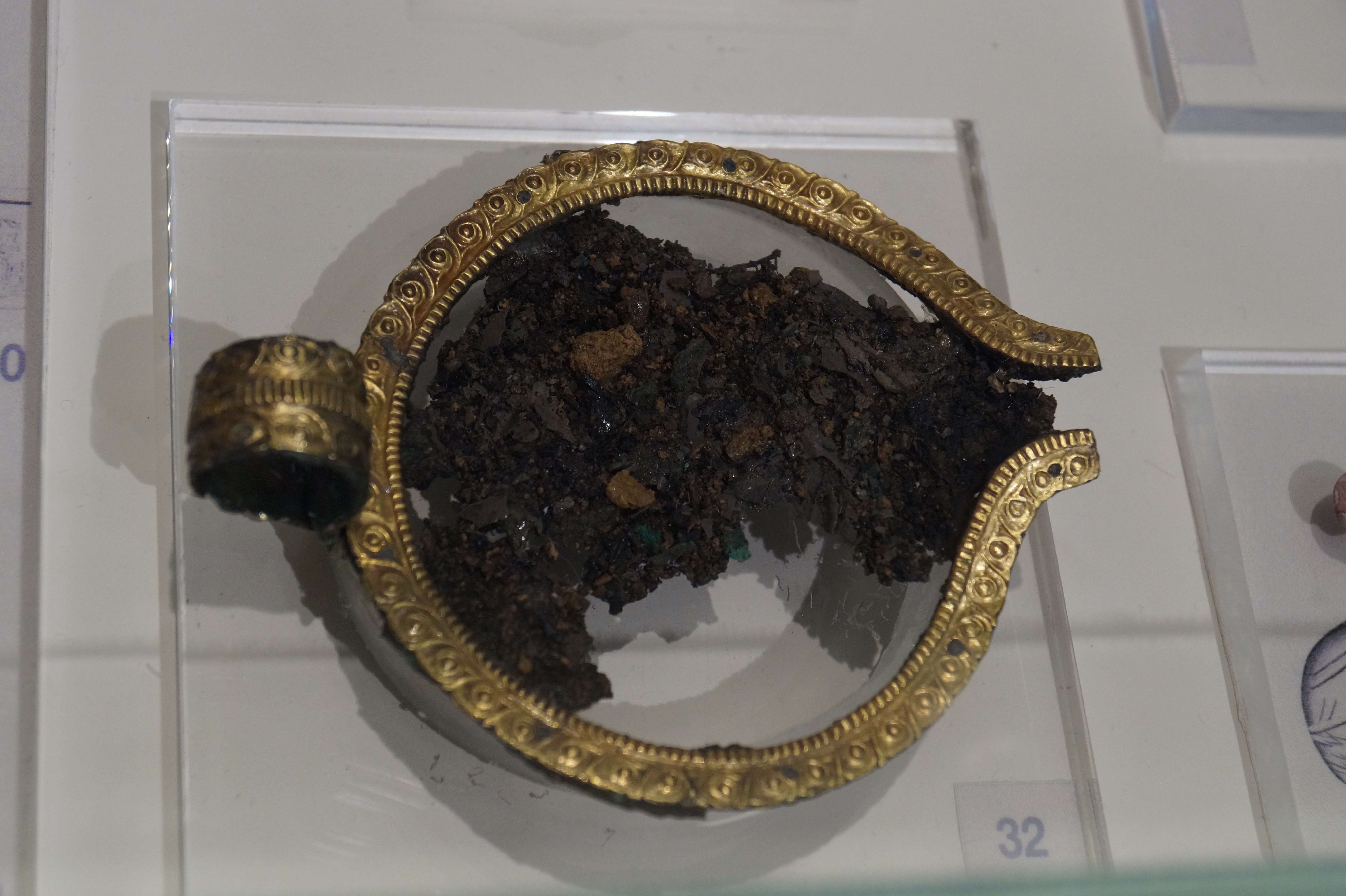 Archaeological Museum of Nafplio: Silver cup with golden rim and handle from pit II of Kazarma Tholos Tomb. (1500-1450 BC)