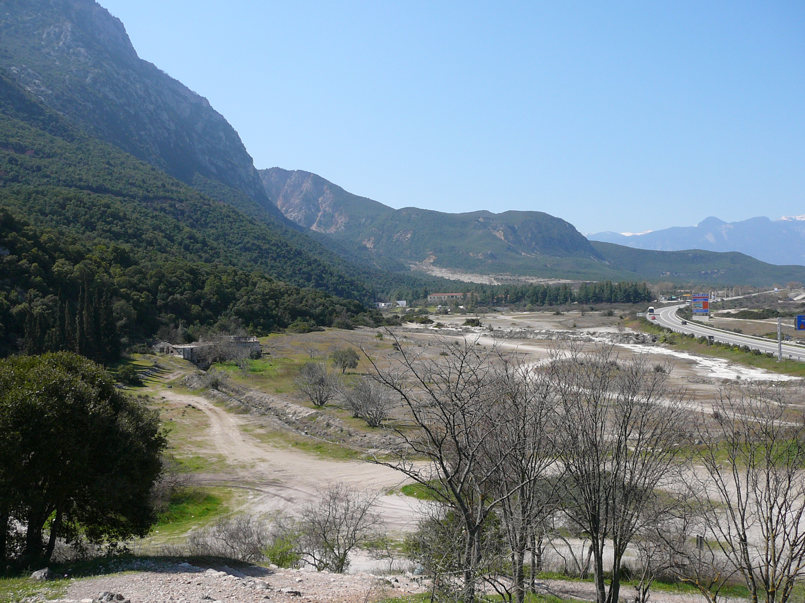 View of the Thermopylae pass at the area of the Phocian Wall. In ancient times the coastline was where the modern road lies, or even closer to the mountain.