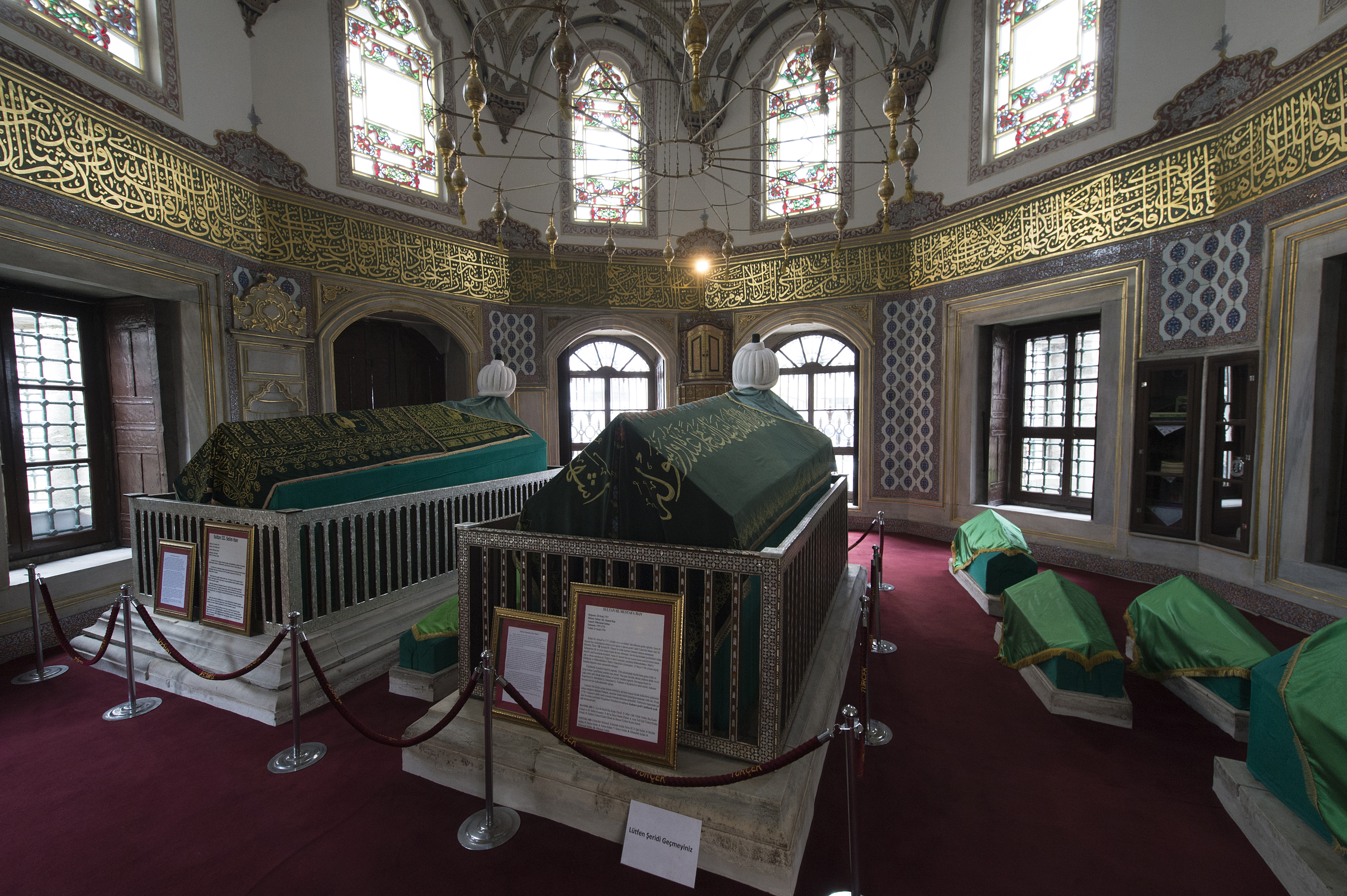 Founded by Mustafa III, built 1759-1763, design by Mehmet Tahir Aga, "greatest and most original of the Turkish baroque architects" (I quote Strolling through Istanbul). It's built on a raised platform, and stands aloof from the busy Ordu Caddesi. 
In the complex there is a mausoleum, this is a picture. Sultan Mustafa III (1717-1774) is described at the tomb as very well educated, interested in astrology and history, very religious and kind hearted. After an earthquake of two minutes that destroyed half of Istanbul he helped the people from his own wealth. He believed in the necessity for reform. He sent Ahmet Resmi Efendi to Frederick II of Prussia, who let Mustafa know (his) 4 secrets: Read history and examine the experiences; Have a powerful army and teach soldiers in time of peace.
The sultan died of an heart attack in 1774 during the Ottoman-Russian War.

Sultan Selim III (1761-1808) was Mustafa III’s son. From the Wikipedia: Selim III (Ottoman Turkish: سليم ثالث Selīm-i sālis) (24 December 1761 – 28 or 29 July 1808) was the reform-minded Sultan of the Ottoman Empire from 1789 to 1807. The Janissaries eventually deposed and imprisoned him, and placed his cousin Mustafa on the throne as Mustafa IV. Selim was killed by a group of assassins subsequently after a Janissary revolt.