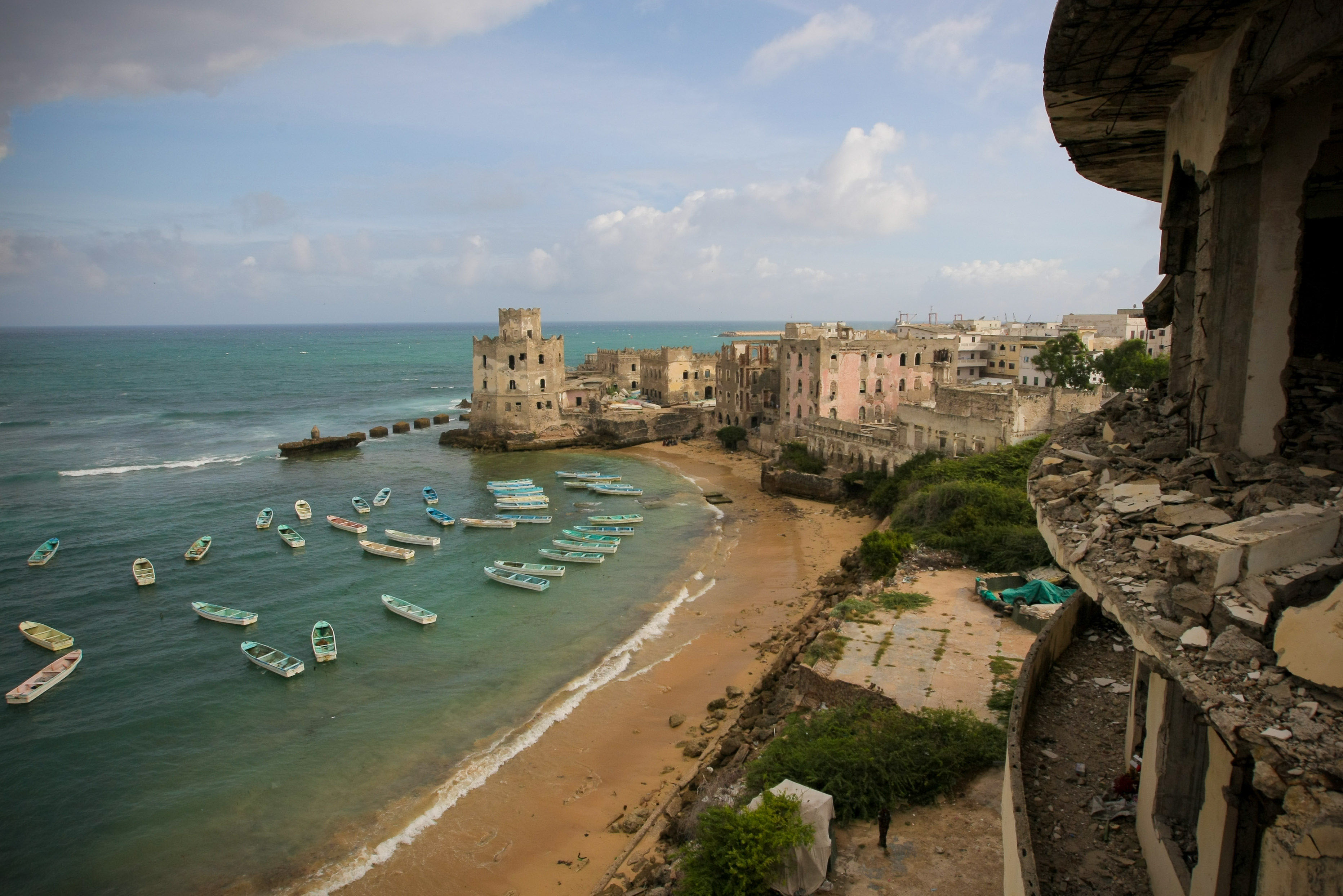 View of Mogadishu fishing harbour from the Aruba Hotel 06 August 2012, in the Somali capital Mogadishu. August 06 is the one-year anniversary marking the date that Al-Qaeda-affiliated extremist group Al Shabaab withdrew from fixed positions in Mogadishu after having steadily lost territory to forces of the Transitional Federal Government (TFG) backed by troops from the African Union Mission in Somalia (AMISOM), ending their draconian stranglehold on the capital and its population. In the last 12 months, residents of Mogadishu have enjoyed the longest period of relative peace in their city for 20 years, with re-building and re-generation work taking place all over the city and businesses and a semblance of normal daily life returning to the now busy streets of the war-shattered Horn of Africa capital. AU-UN IST PHOTO / STUART PRICE.