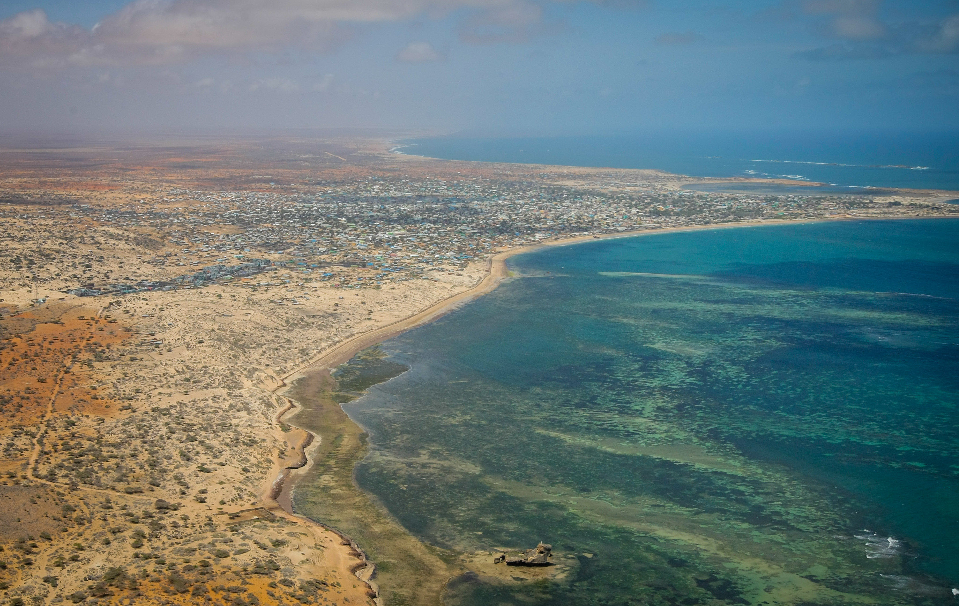 Aerial view of the southern Somali port city of Kismayo, 04 October 2012. The last bastion of the once feared Al-Qaeda-affiliated extremist group Al Shabaab, Kismayo fell after troops of the Somali National Army (SNA) and the pro-government Ras Kimboni Brigade supported by the Kenyan Contigent of the African Union Mission in Somalia (AMISOM) entered the port city on 02 October following a two month operation across southern Somalia which saw the liberation of villages and centres along a distance of 120km from Afmadow to Kismayo. AU-UN IST PHOTO / STUART PRICE.