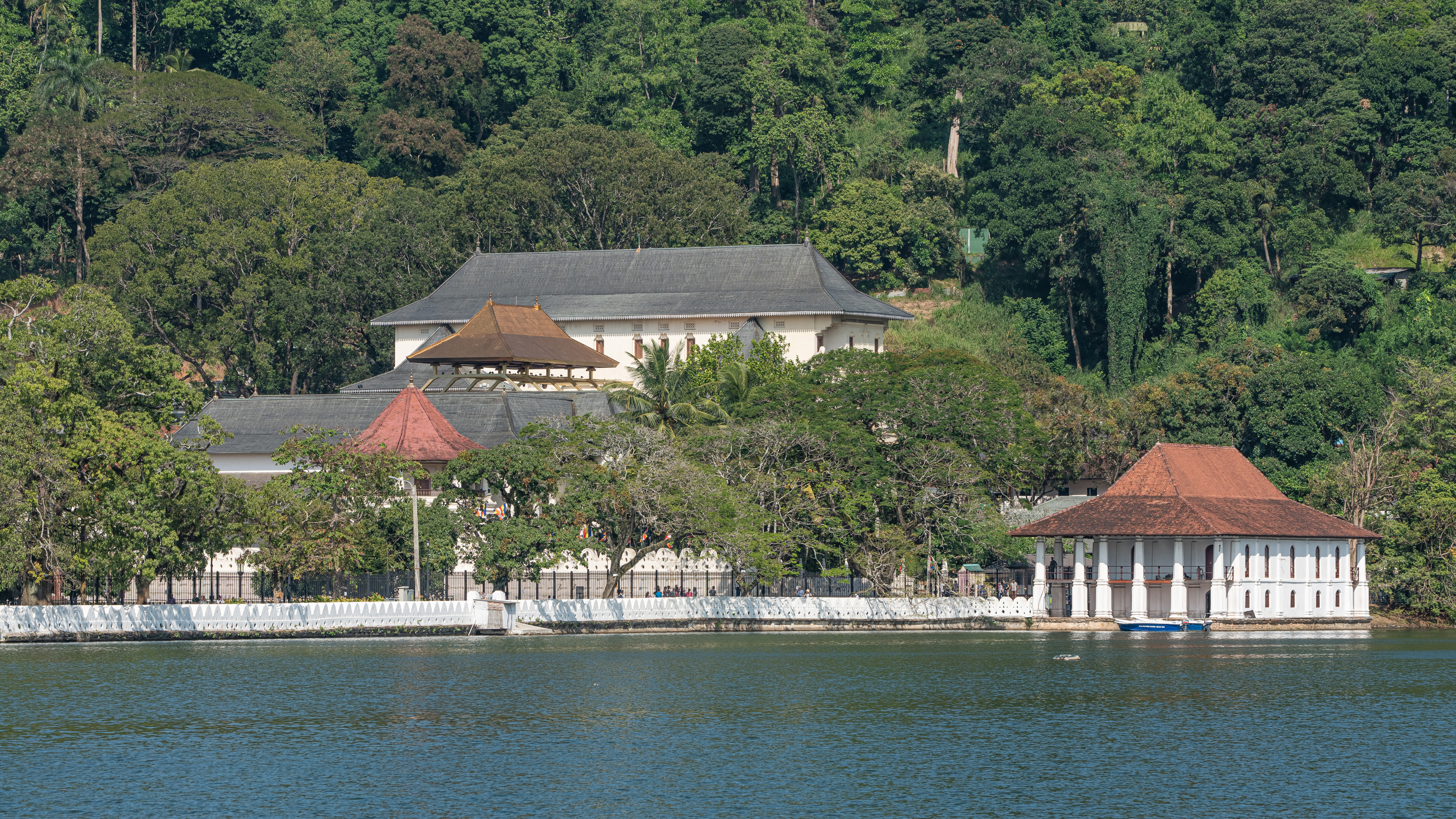 View of the Sacred Tooth Temple and Queen's Bath from the south bank of Kandy Lake in Kandy, Sri Lanka