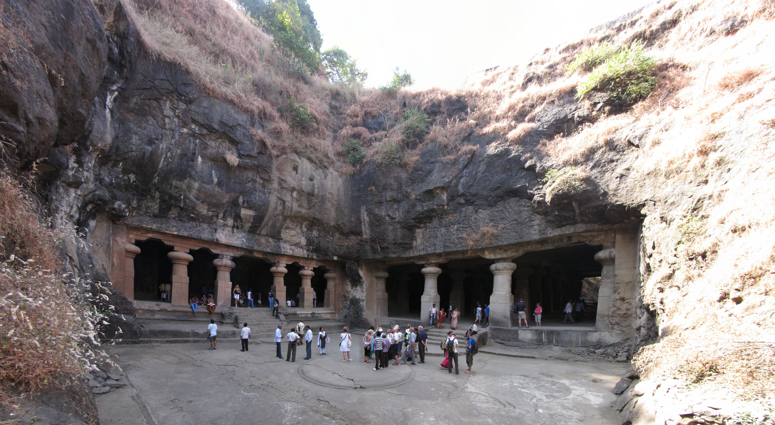 Cave 1 east entrance (right door) middle courtyard connecting the east-end cave (left door). A panoramic view