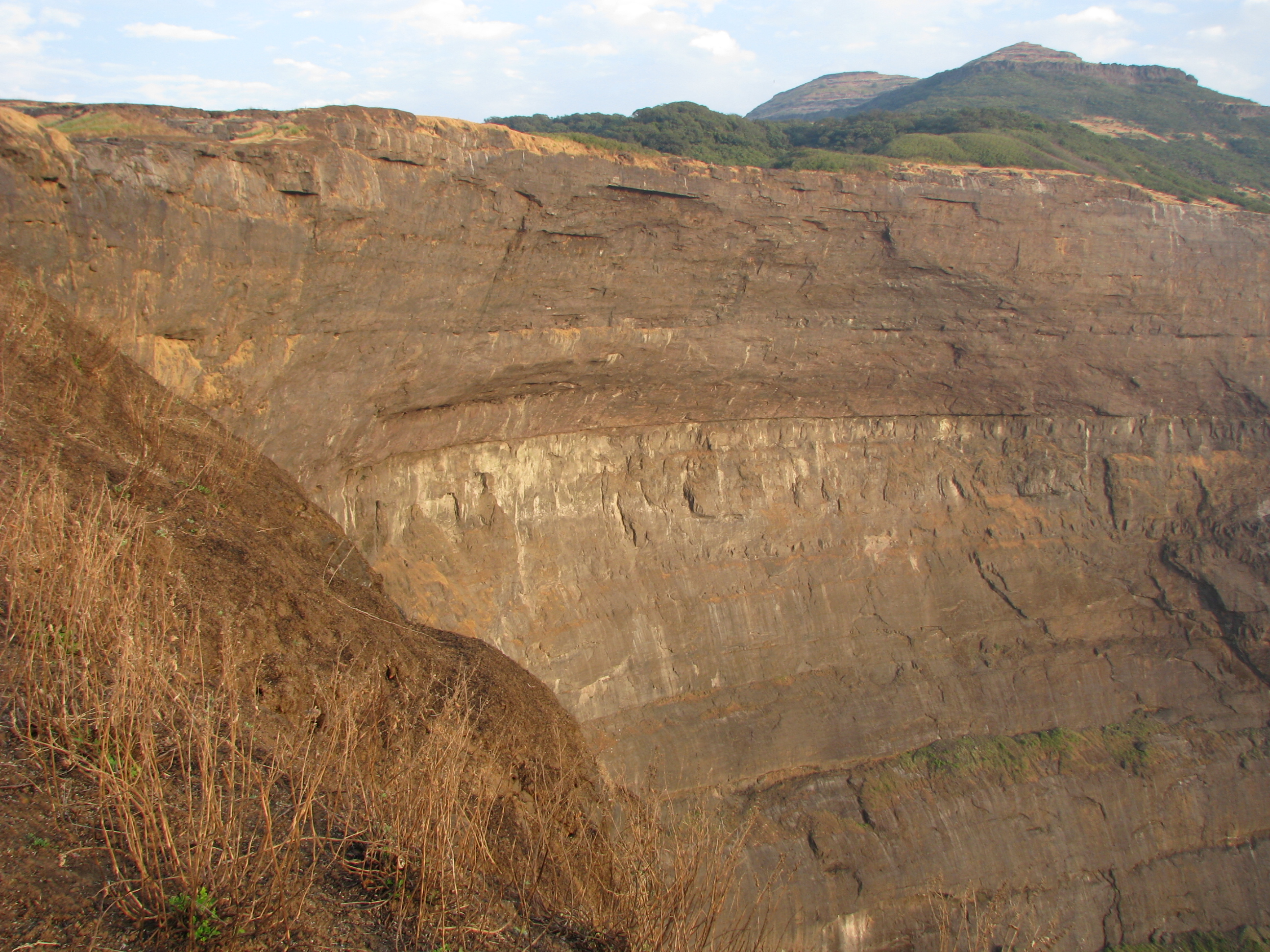 This photo is of "Kokan kada" at harishchandragad (Maharashtra india).
The cliff faces west and looks down upon the Konkan From here, one can have a breathtaking view of the surrounding region and the setting sun