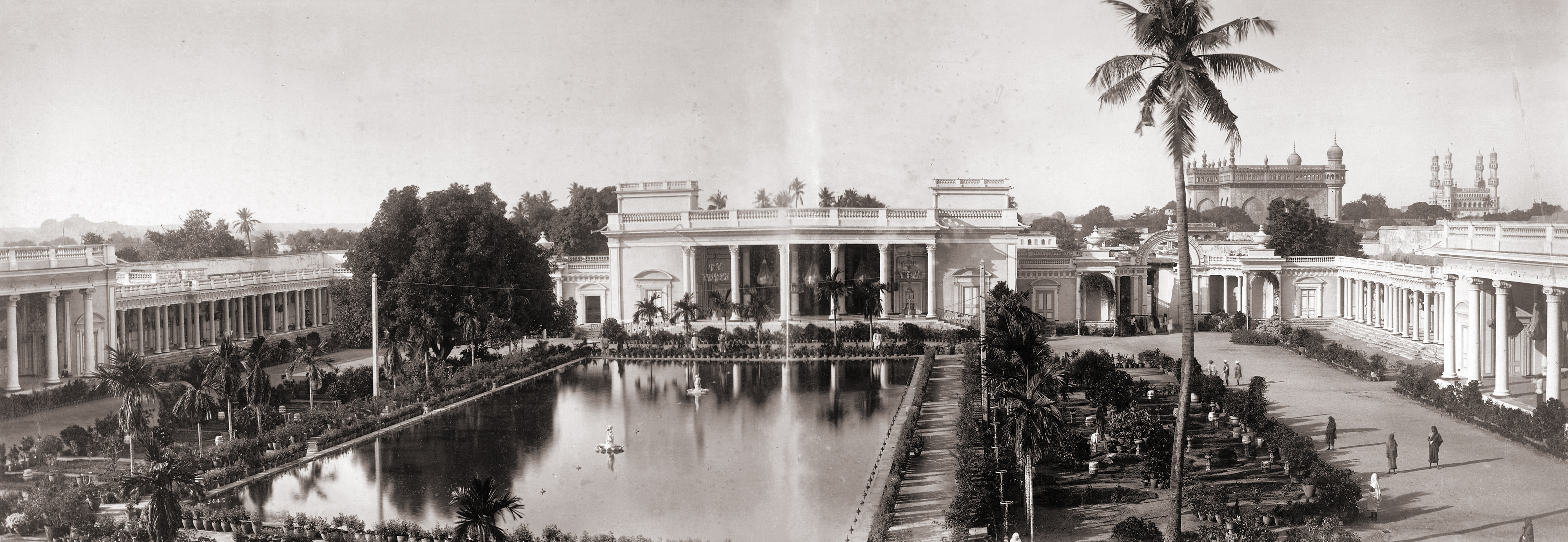 Panoramic view in two parts of the Chaumhalla Palace at Hyderabad, photographed by Deen Dayal in the 1880s. This is part of the Curzon Collection: 'Views of HH the Nizam's Dominions, Hyderabad, Deccan, 1892'. The Chaumhalla Palace complex is made up of four palaces: the Afzal Mahal, Mahtab Mahal, Tahniyat Mahal and Aftab Mahal, all arranged around a central courtyard garden with a marble cistern in the centre. The Chaumhalla Palace was commenced in 1750 with later additions by successive Nizams.