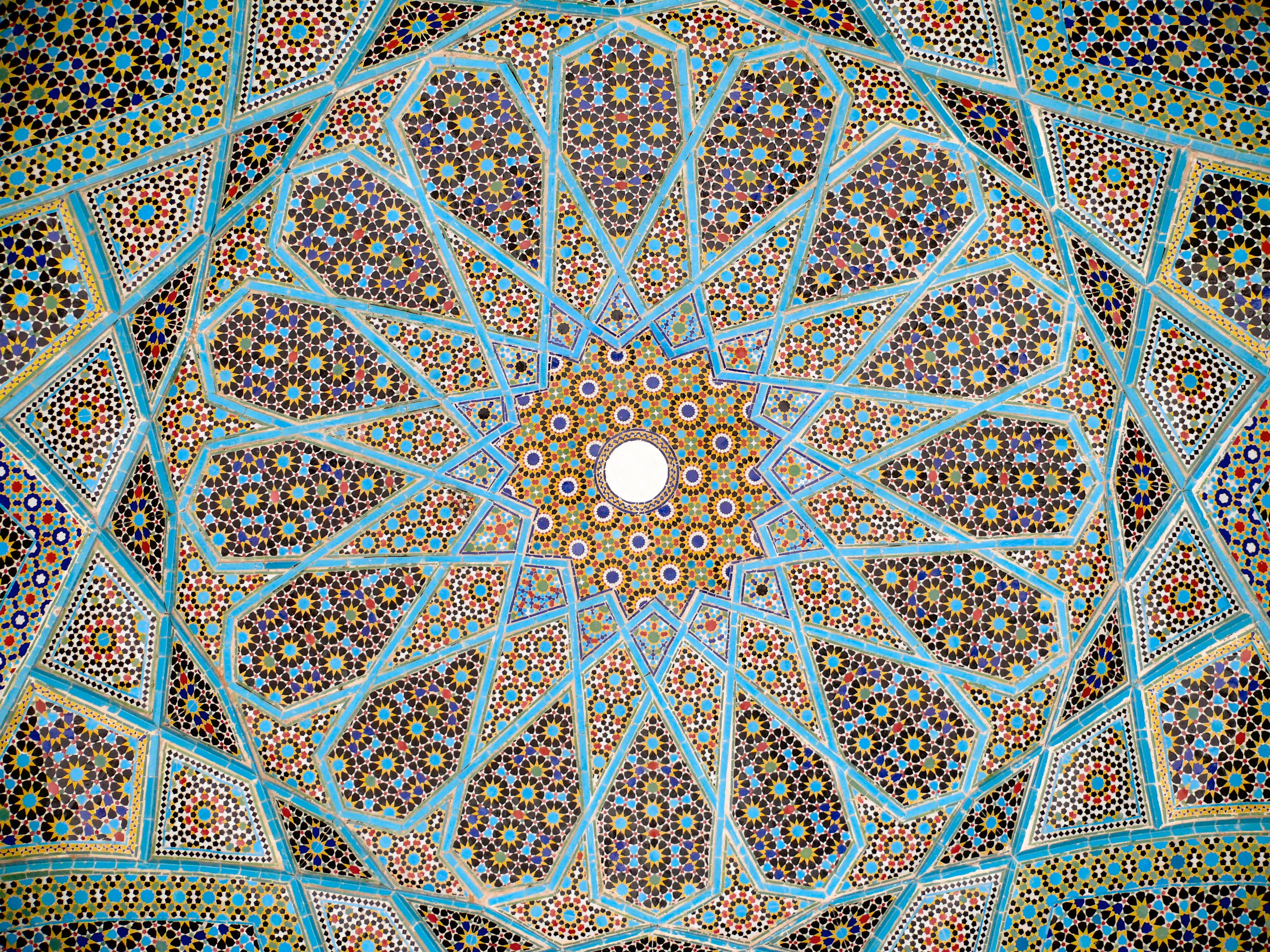 Iranian glazed ceramic tile work, from the ceiling of the Tomb of Hafez in Shiraz, Iran. Province of Fars.