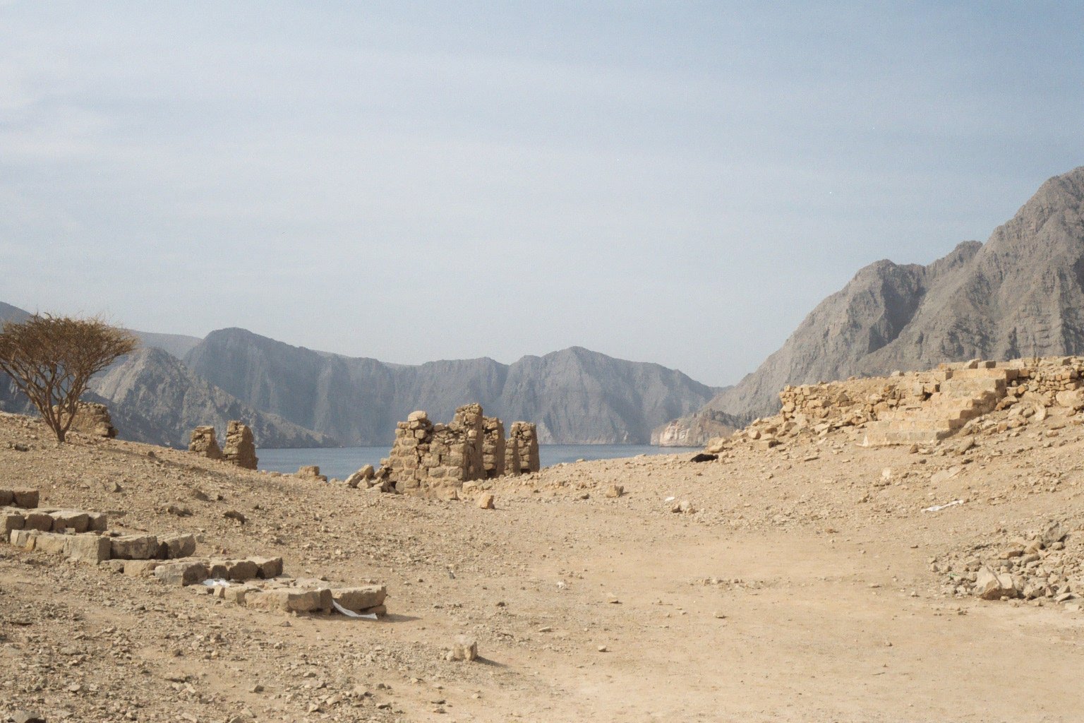 Telegraph Island in a fjord at Musandam Peninsula, Oman. This island, having a diameter of about 150 meters, was home to several british when the telegraph line to India was built. Not all of its inhabitants could cope with the isolation. The phrase "going round the bend" has its origin from this island.