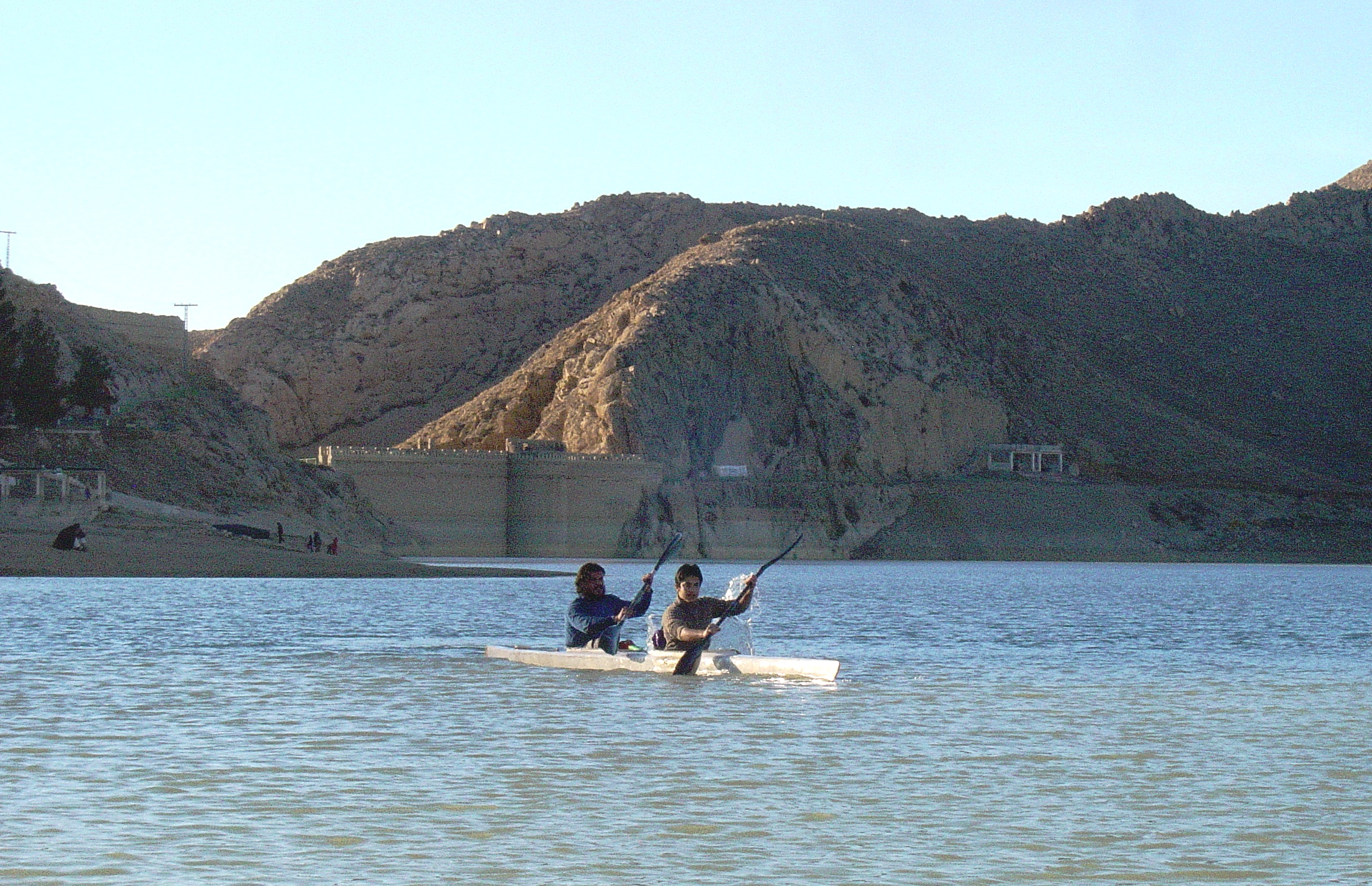 Ali Khilji and Abubakar Durrani Kayaking in front of Hanna Lake Bridge Wall constructed by Great Britain in 1894.