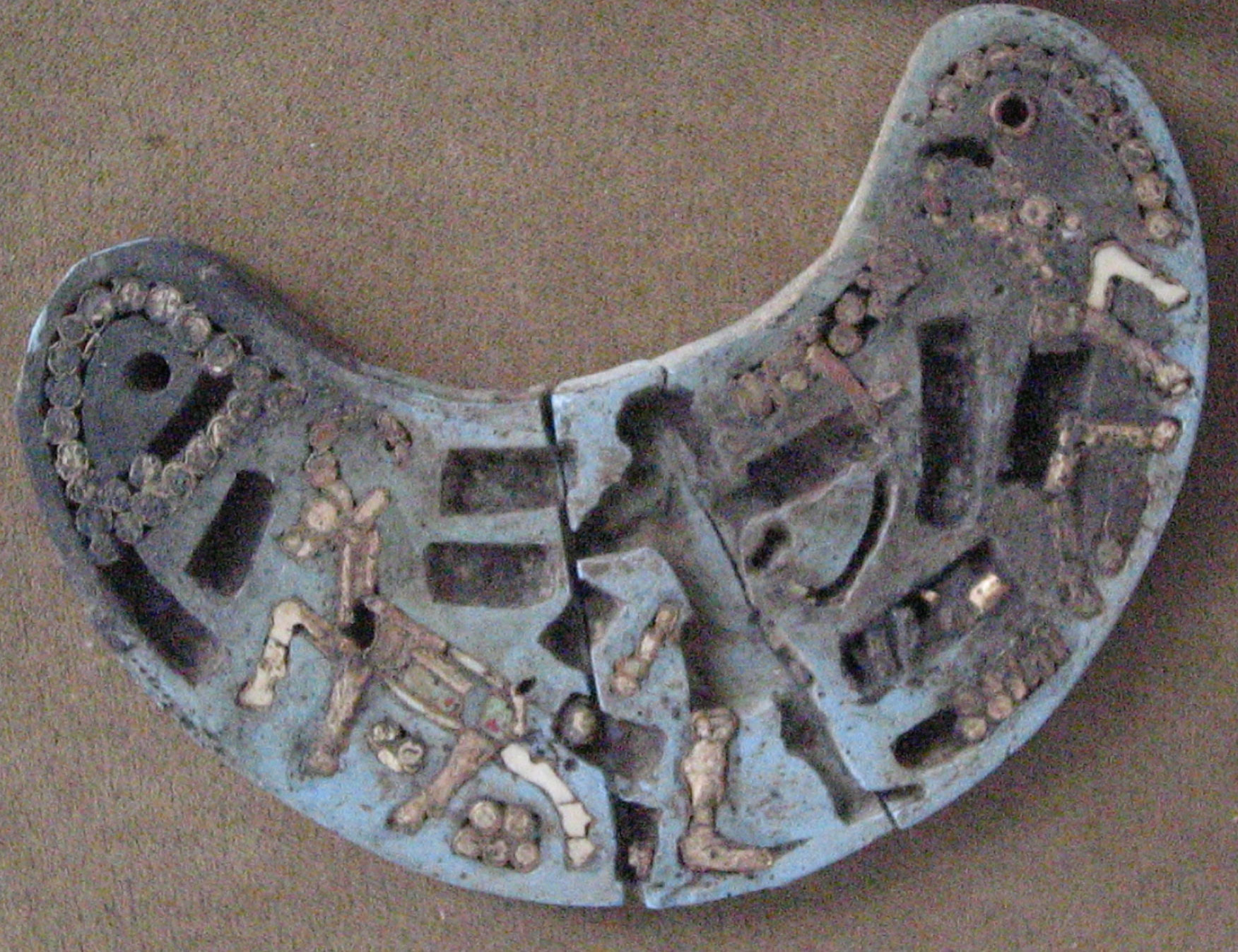 crescent shaped plaque, Hasanlu, early 1st mil BC. National Museum of Iran.