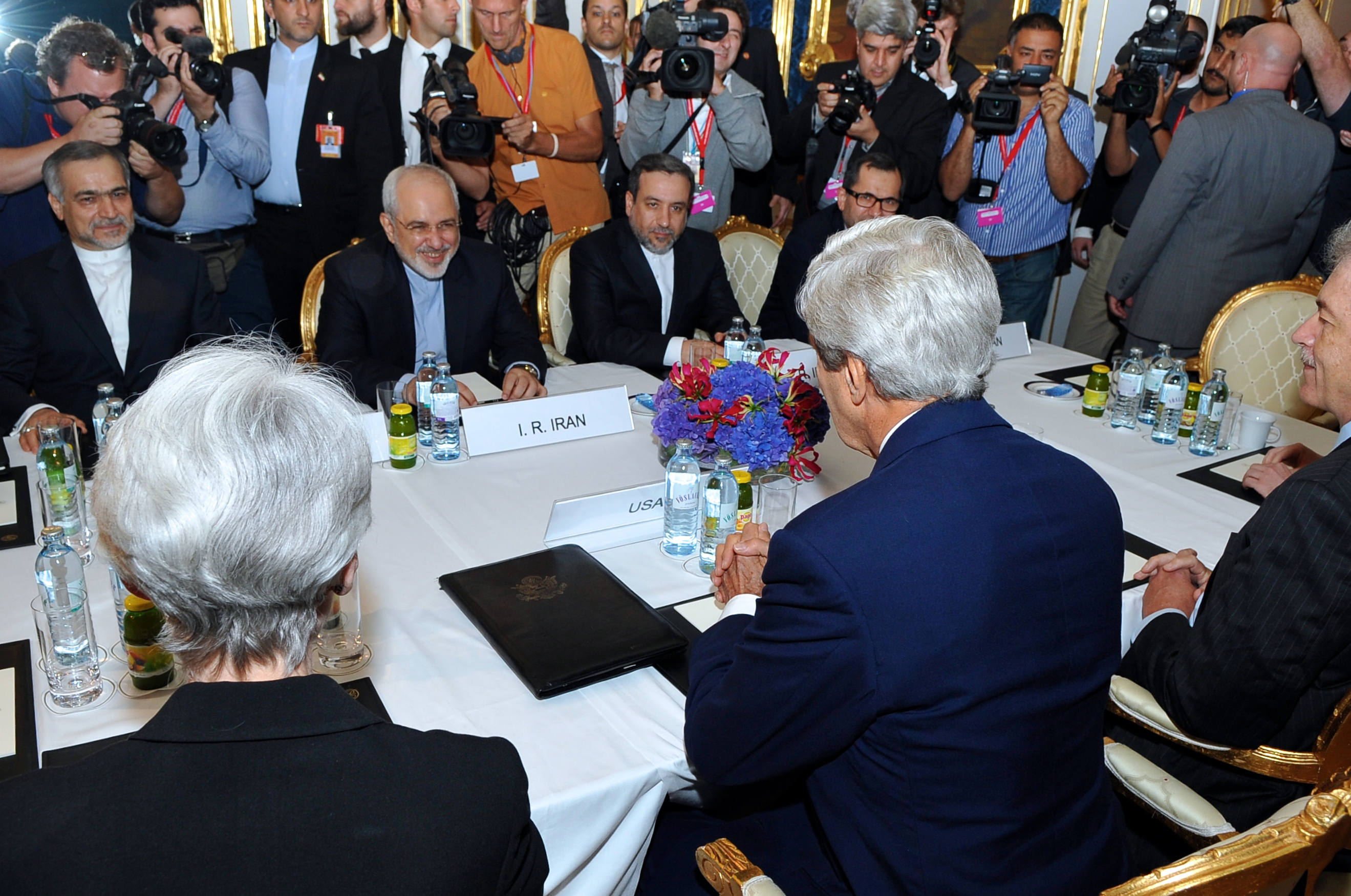 U.S. Secretary of State John Kerry sits across from Iranian Foreign Minister Mohammad Javad Zarif in Vienna, Austria, on July 13, 2014, before they begin a bilateral meeting focused on Iran's nuclear program. [State Department photo/ Public Domain]