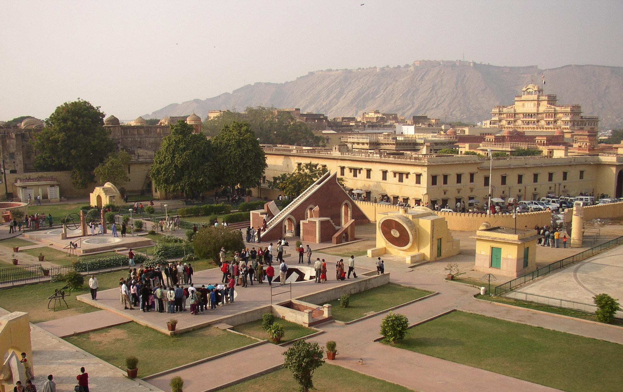 Taken from the observation platform at the top of the Jantar Mantar, showing smaller architectural sundials. The Jantar Mantar is a collection of architectural astronomical instruments, built by Maharaja Jai Singh II at his then new capital of Jaipur between 1727 and 1733. The City Palace behind then Govindji Temple. Nahargarh Fort on Hill.