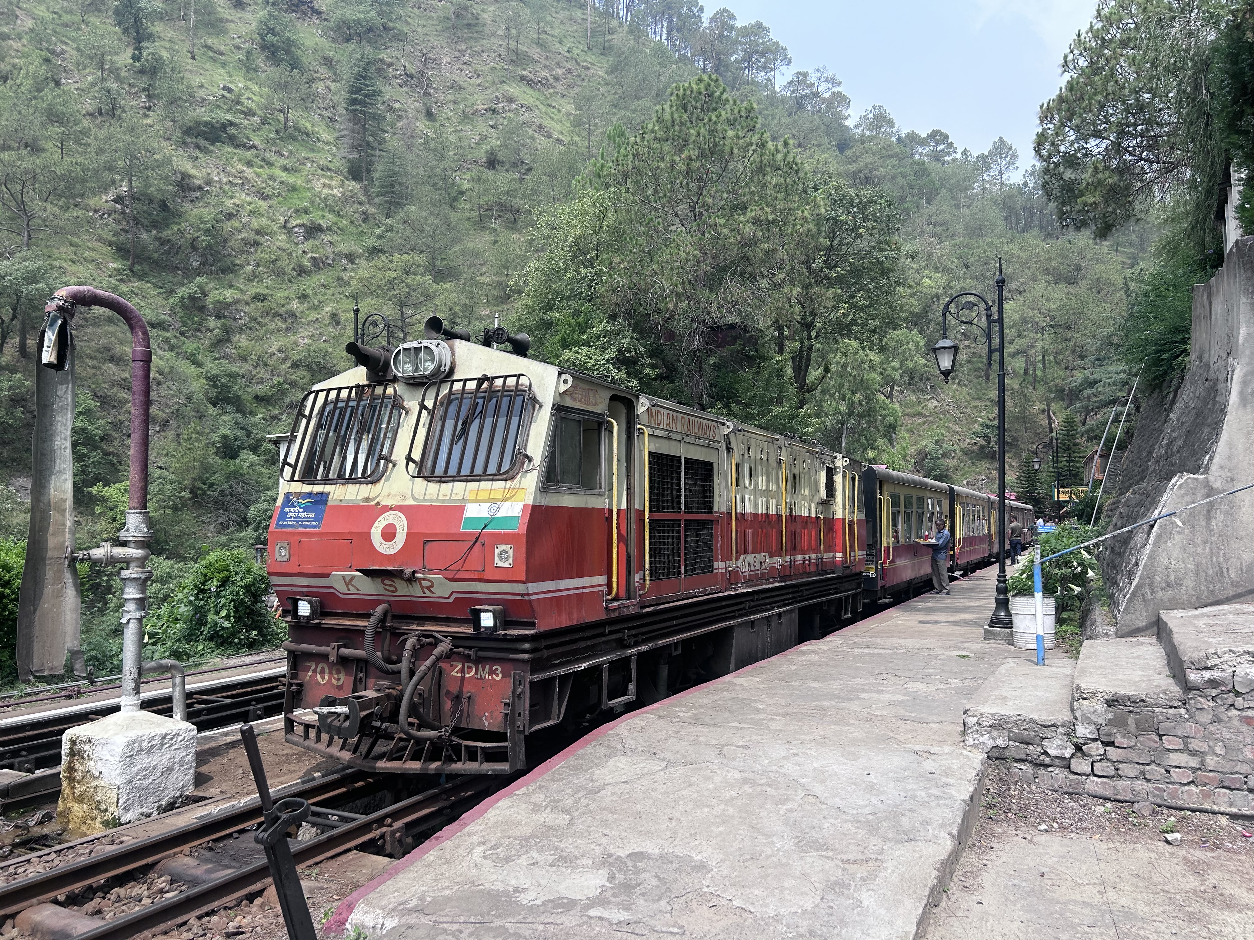 The Kalka–Shimla Railway is a  narrow-gauge railway in North India which traverses a  mountainous route from Kalka to Shimla. The railway was built under the direction of Herbert Septimus Harington between 1898 and 1903 to connect Shimla, the summer capital of India during the British Raj.
This image was taken on Solan Station on 13 June 2025.