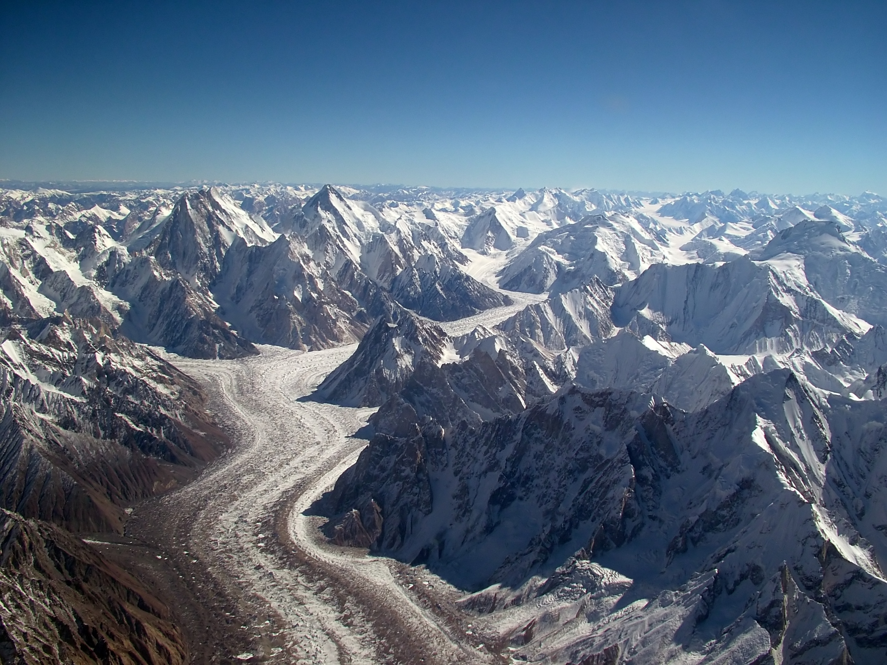 Aerial View of the Baltoro Glacier towards Concordia with Gasherbrum IV and Gasherbrum I on the left, Baltoro Kangri and Chogolisa on the upper right ; Mitre Peak is right in the center (where the glacier turns left while flowing down).