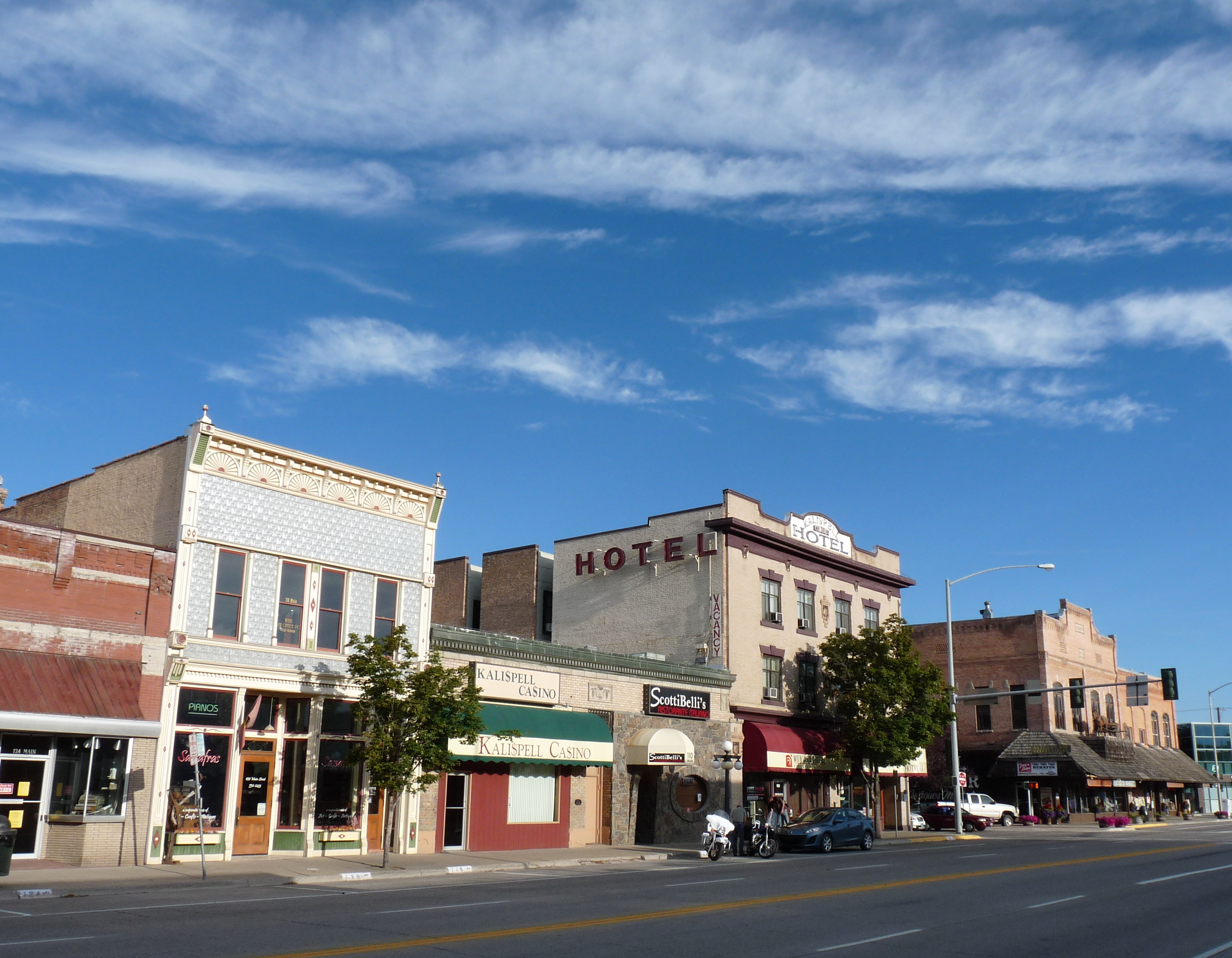 Shown are a few buildings on the Main Street of Kalispell, Montana, USA, including the Brewery Saloon, the Kalispell Grand Hotel, and the McIntosh Opera House.  These buildings and others contribute to Kalispell's Main Street Historic District, recognized by the National Register of Historic Places.
