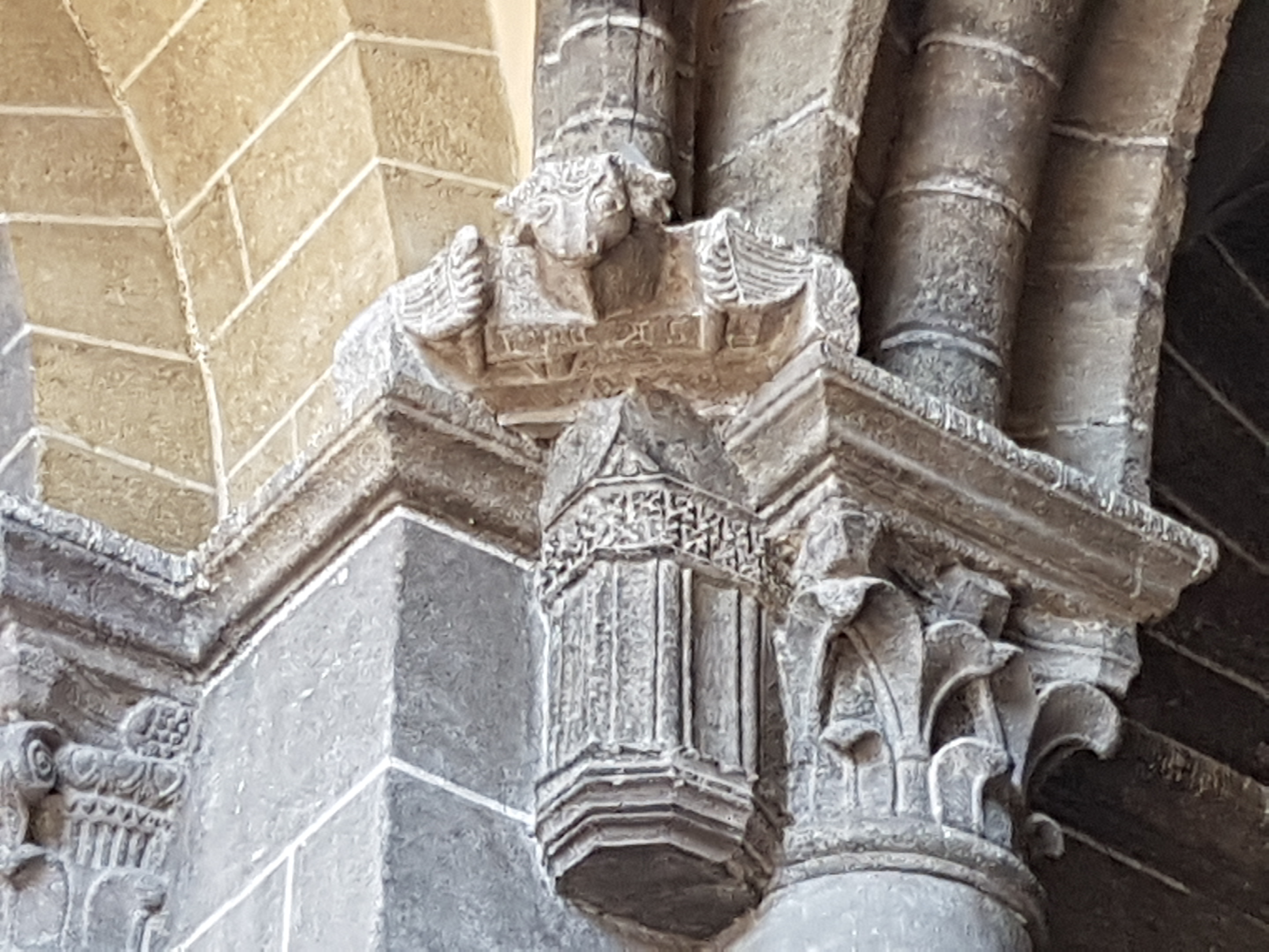 Sculpture of tetramorph in the west porch of Cathedral Notre-Dame in Le Puy-en-Velay. Saint Luke (ox).
