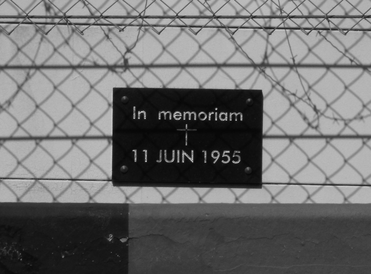 Phtotgraph of the memorial plaque at the site of the 1955 Le Mans disaster, taken by me at the 2009 Le Mans event from the pit lane on the other side of the pit straight